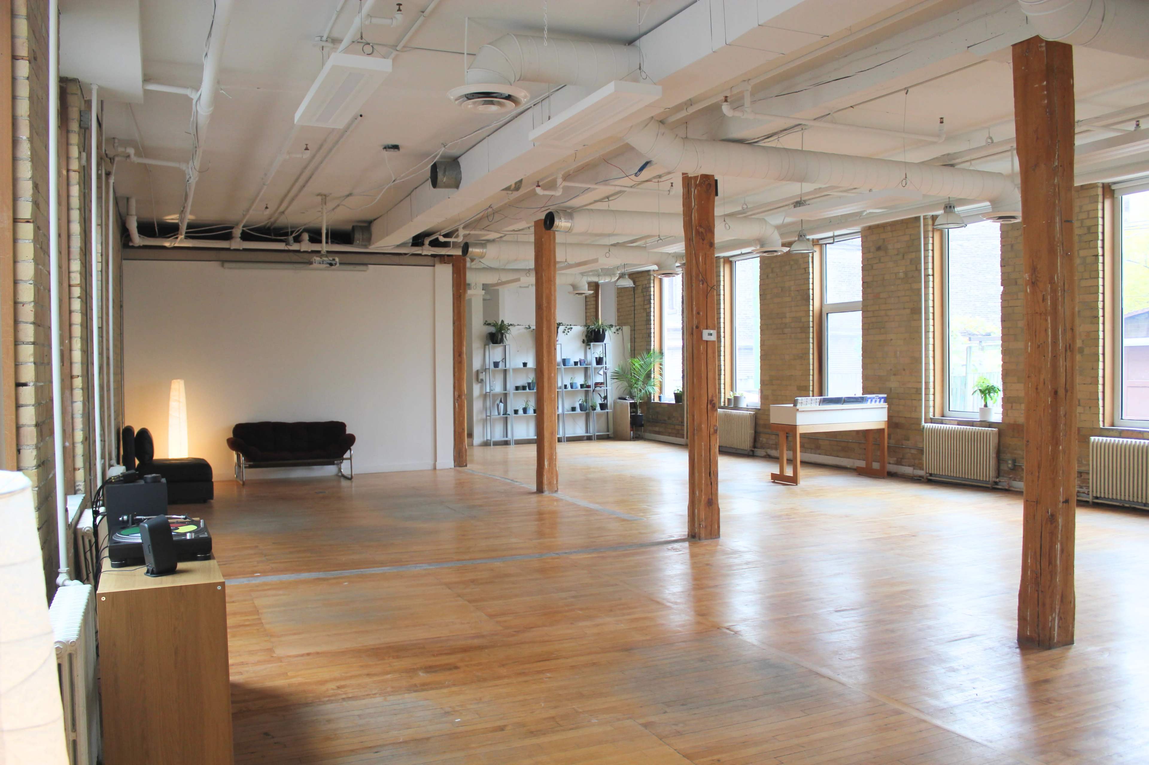 Downtown Loft with Natural Light, Brick, and Exposed Wooden Beams Image in Downtown Toronto, Toronto, ON