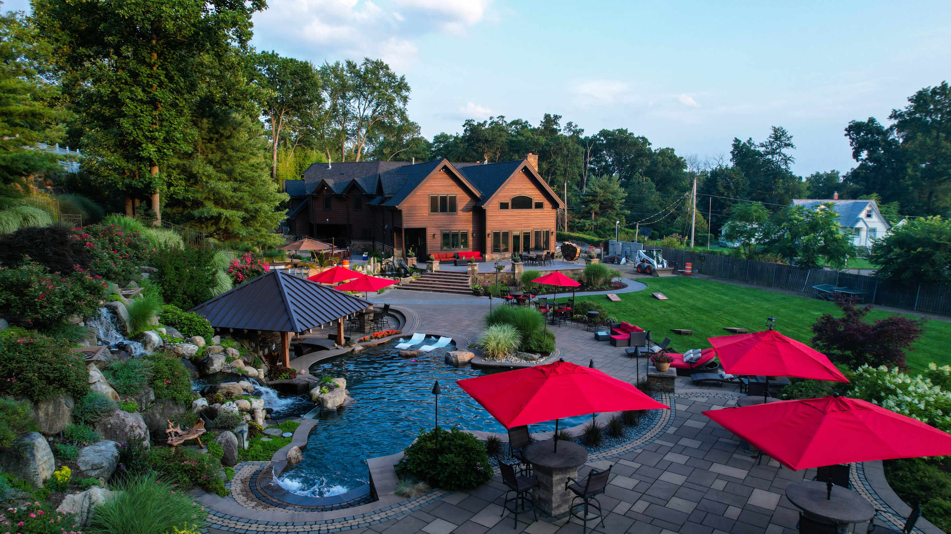 Luxury Resort-Style Backyard Oasis with Pool, Spa, Fire features, Koi pond, Outdoor Dining & entertaining Image in Pompton Plains, Wayne, NJ