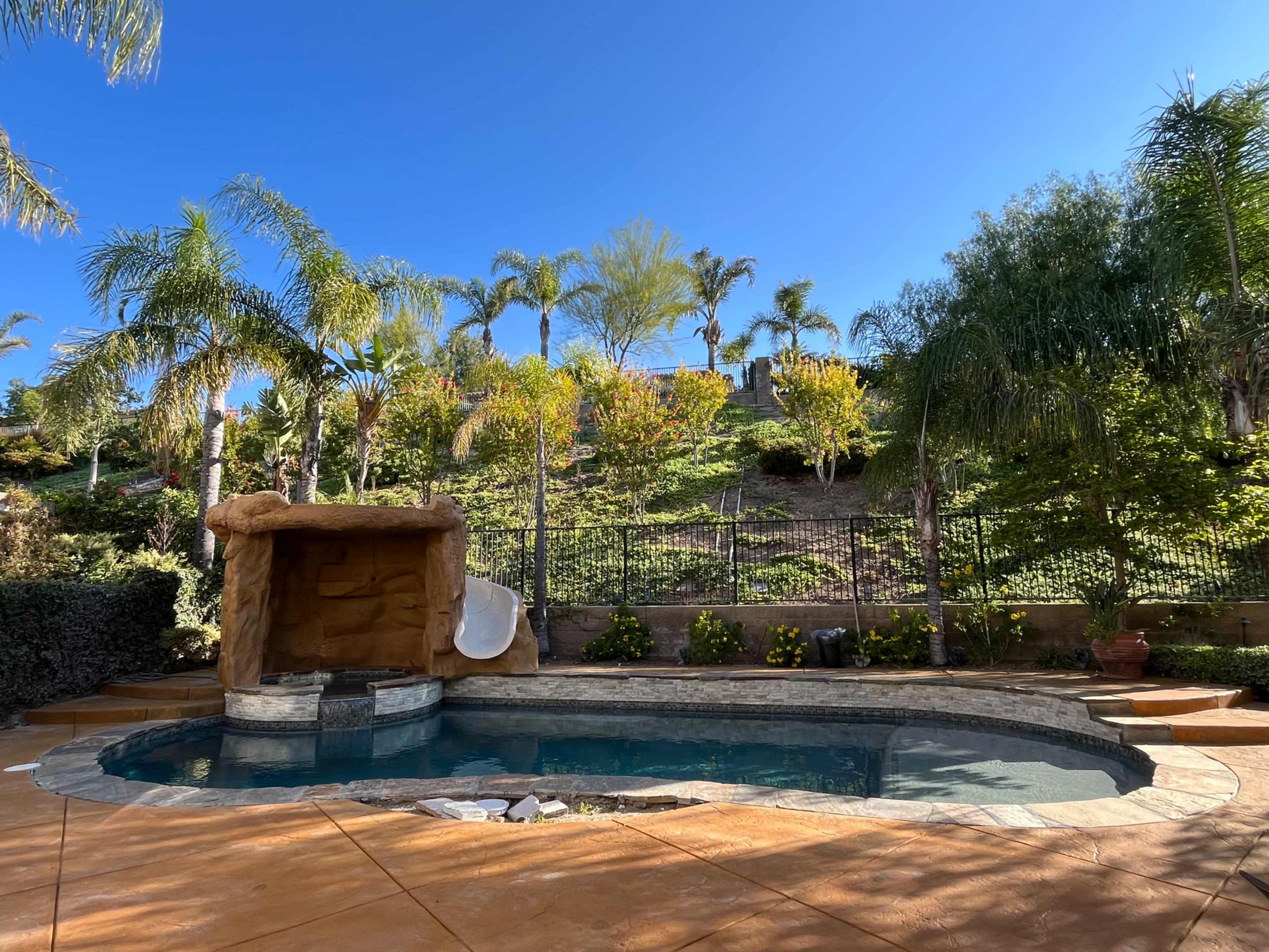 Porter Ranch Oasis with Grotto Waterfall and Slide Image in Chatsworth, Porter Ranch, CA