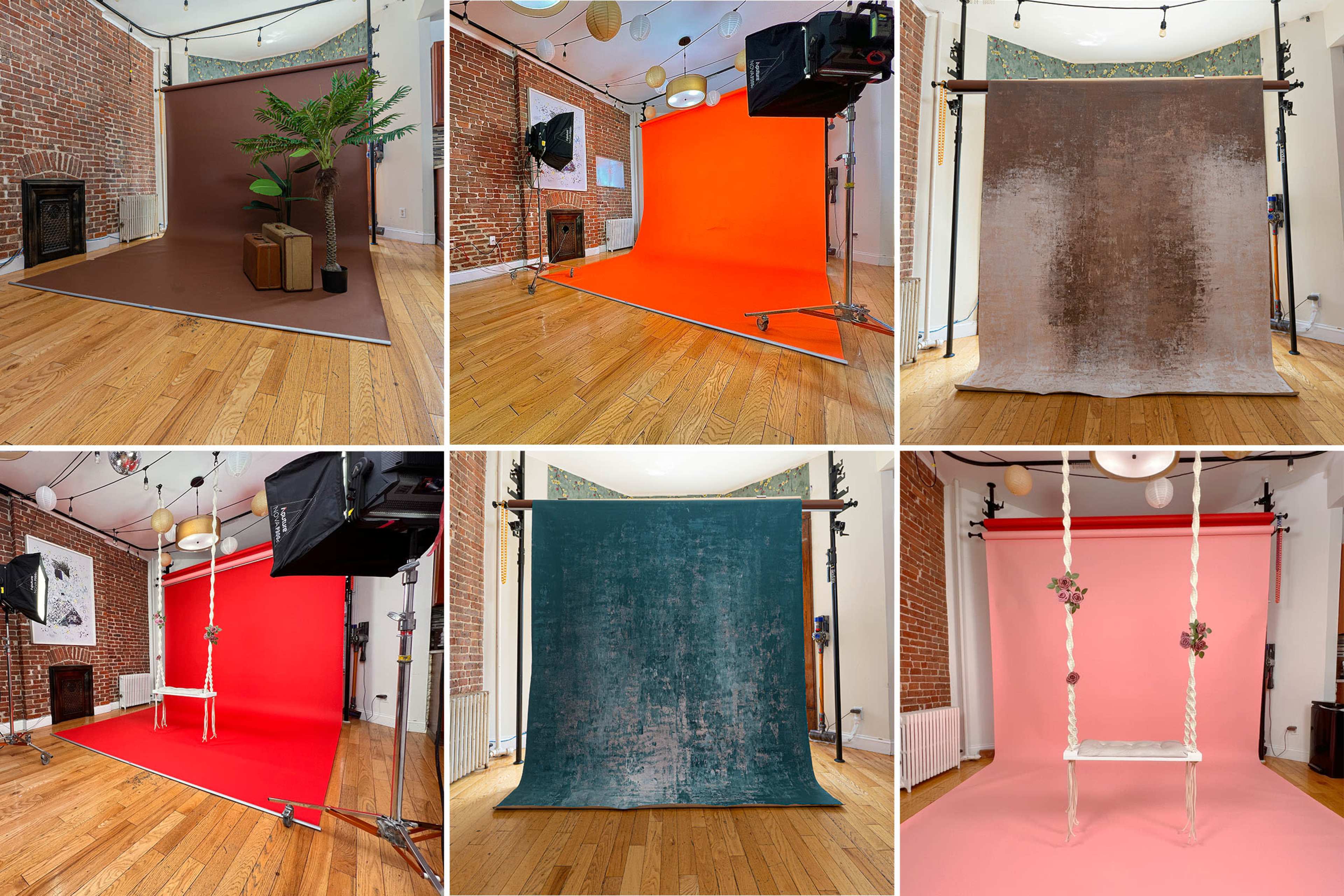 A photo studio with various colored backdrops and props arranged around the space.