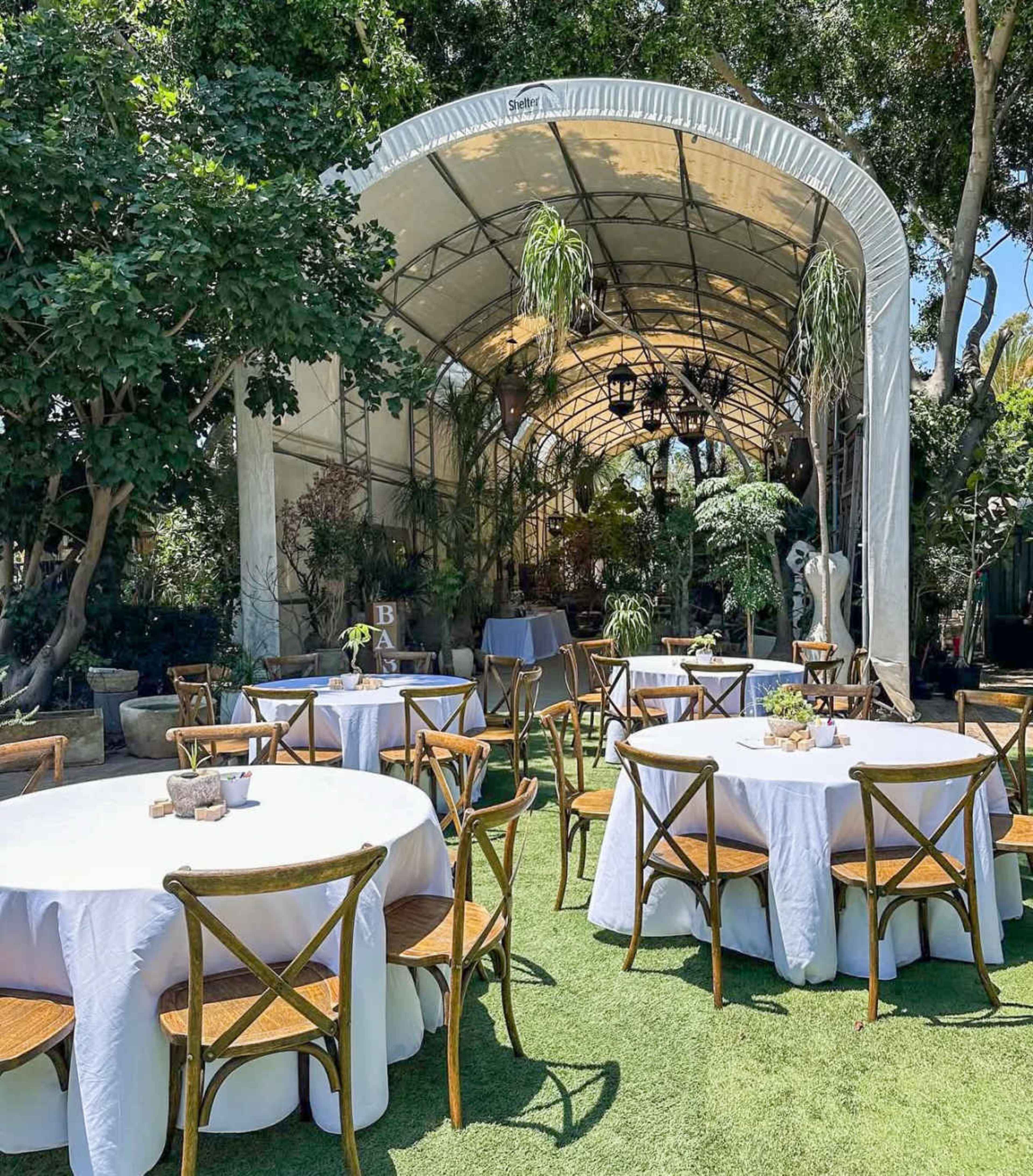 Plant-Filled Greenhouse with Outdoor Gathering Area Image in East Irvine, Irvine, CA