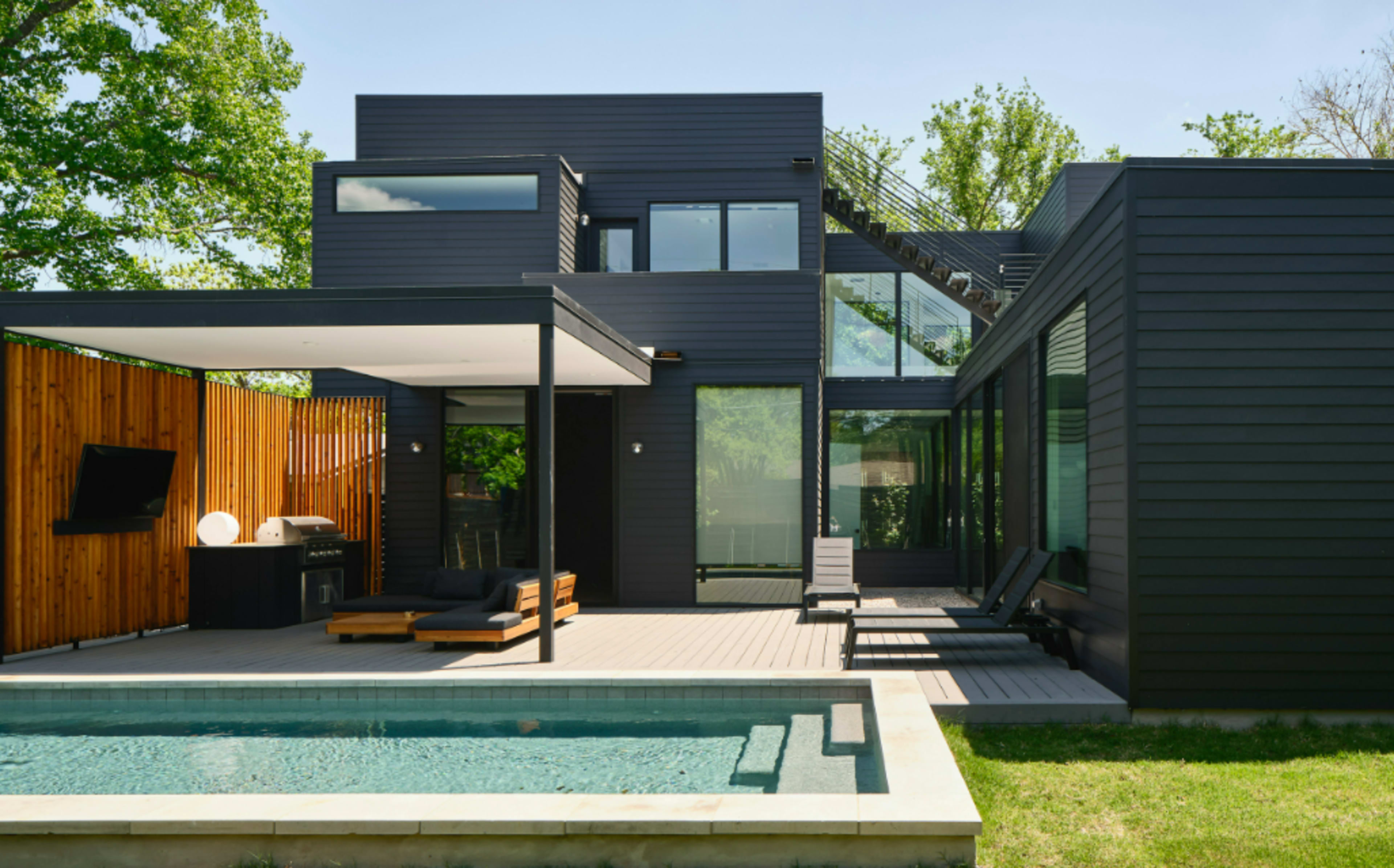 Discover your dream home: a stunning modern contemporary house near South Congress, featuring spacious interiors, a pool, a rooftop hot tub, and breathtaking lighting! Image in St. Edwards, Austin, TX