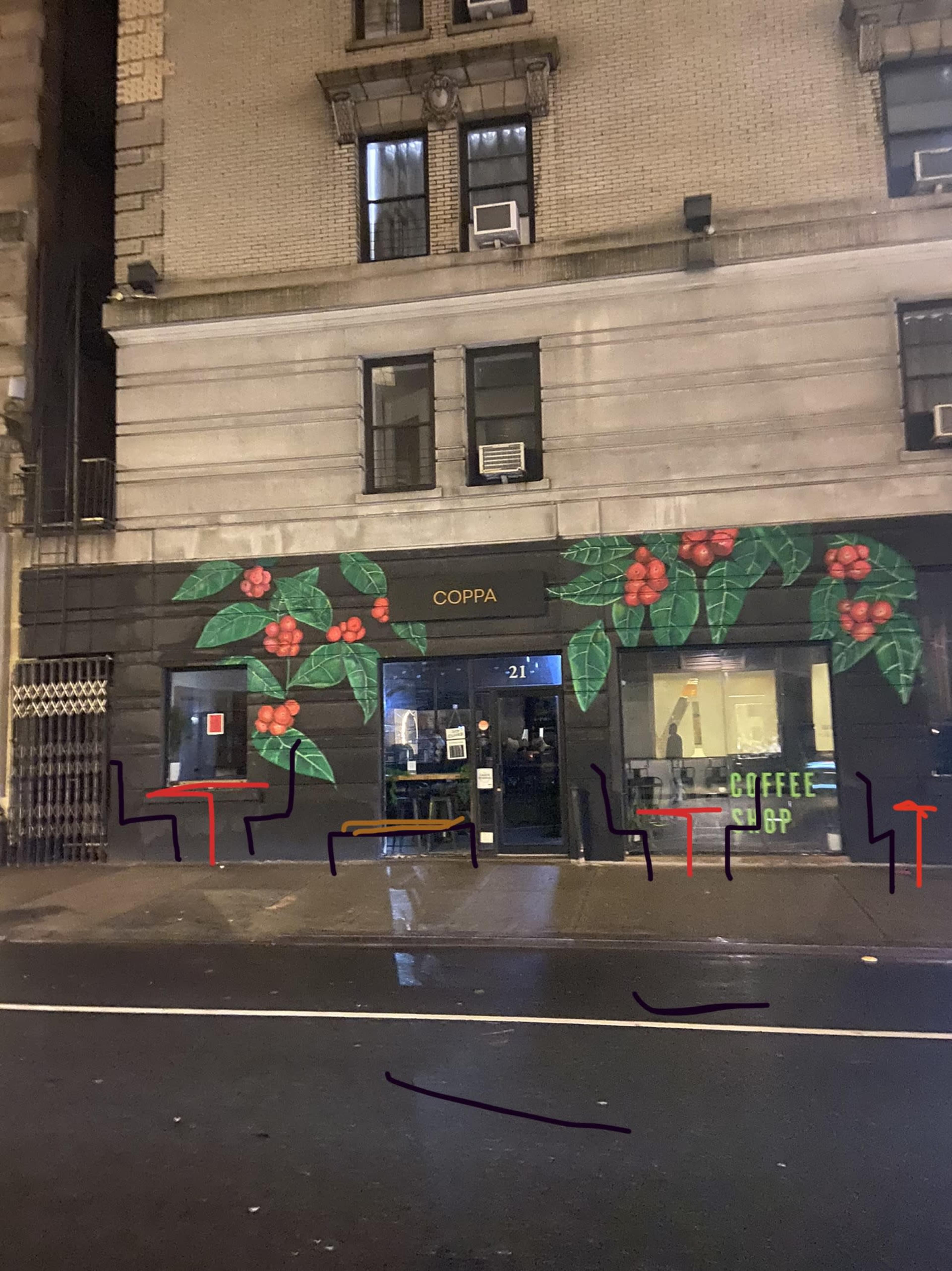 The storefront of Coppa features a green facade adorned with coffee plant murals and includes outdoor seating.