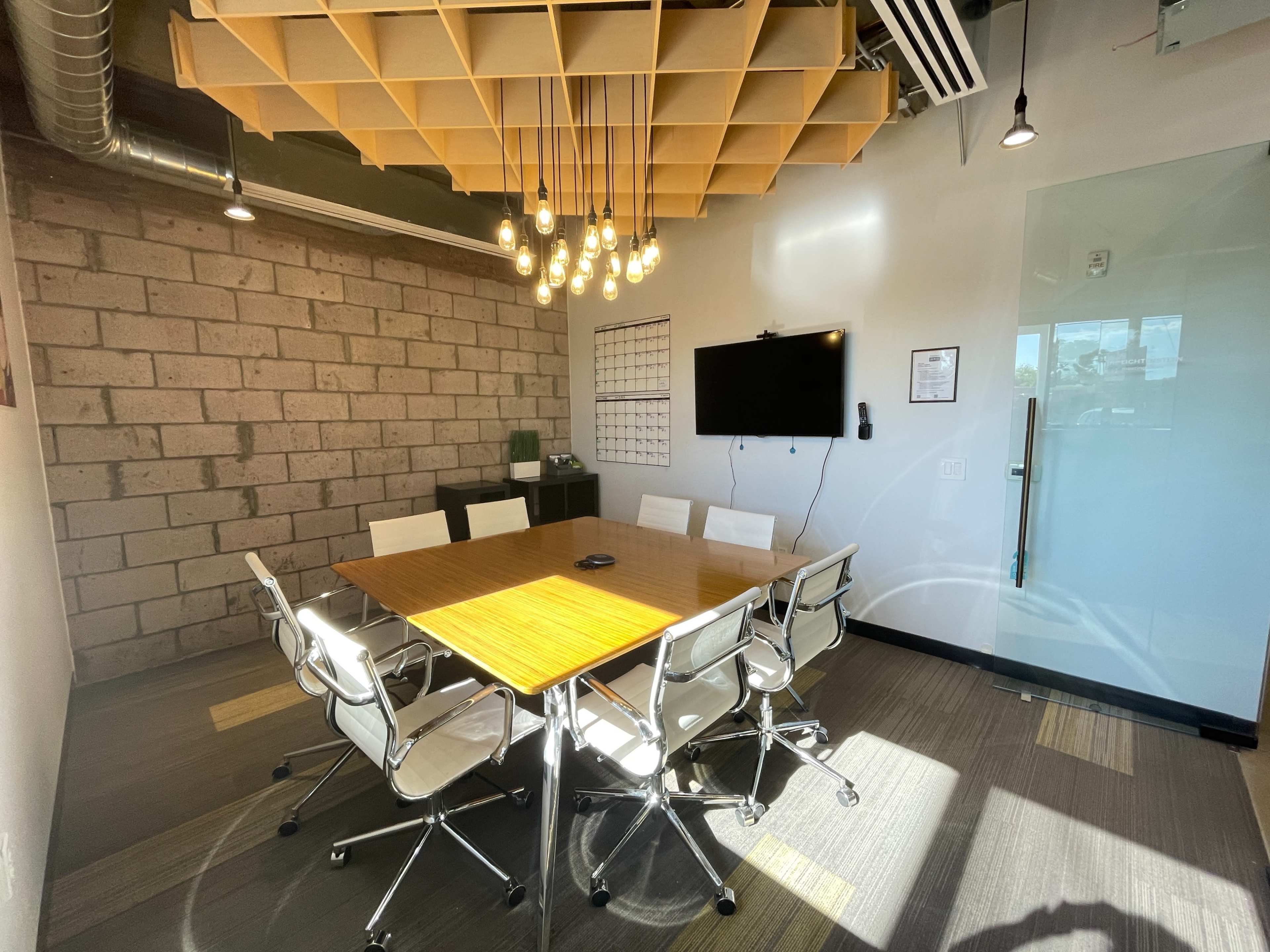 A Warm Industrial Modern Conference Room (great lighting/smart TV) WIFI Image in Camelback East Village, Phoenix, AZ