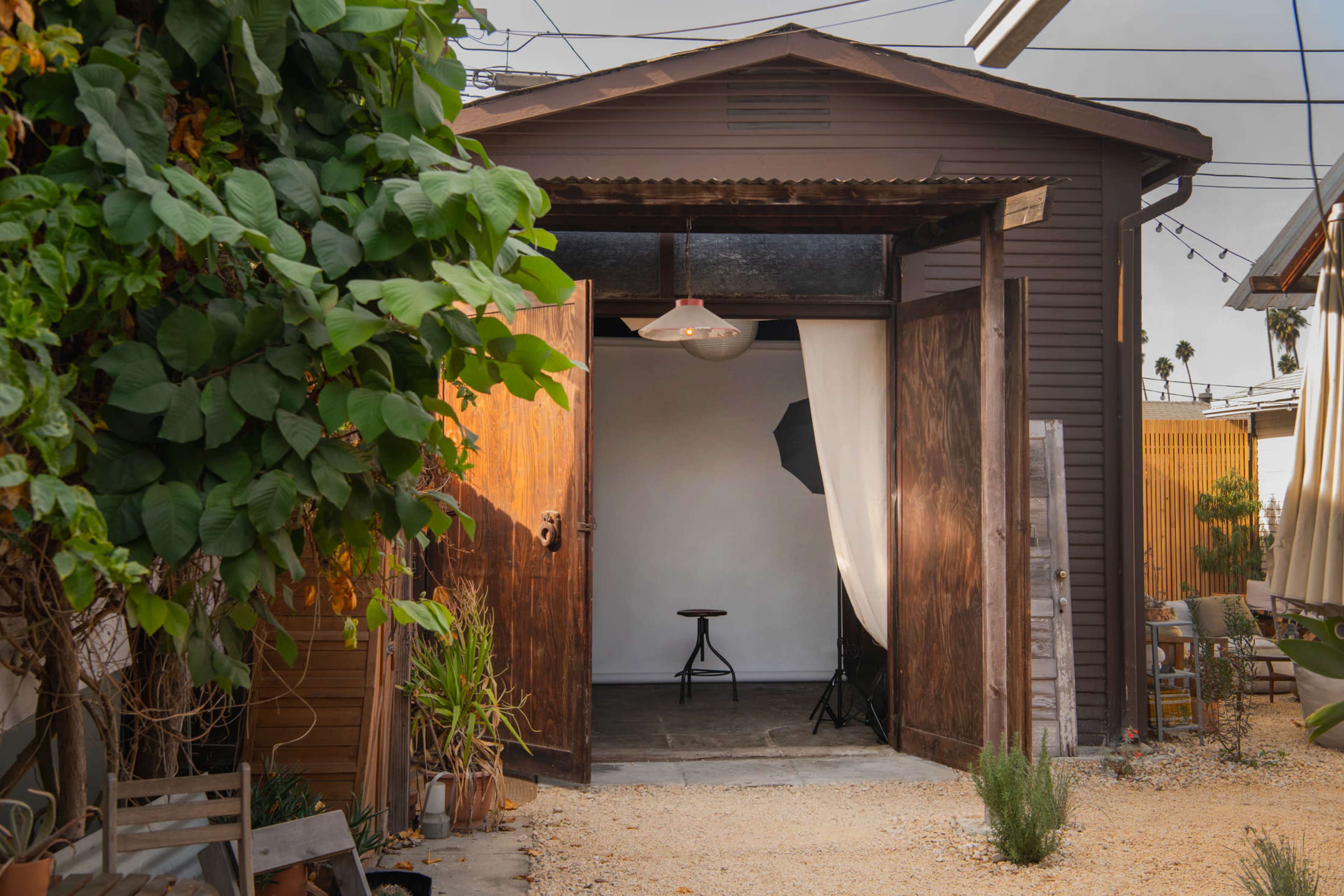 Unique Rustic Urban Back Yard with Cabin and Barn Studio Image in Leimert Park, Los Angeles, CA