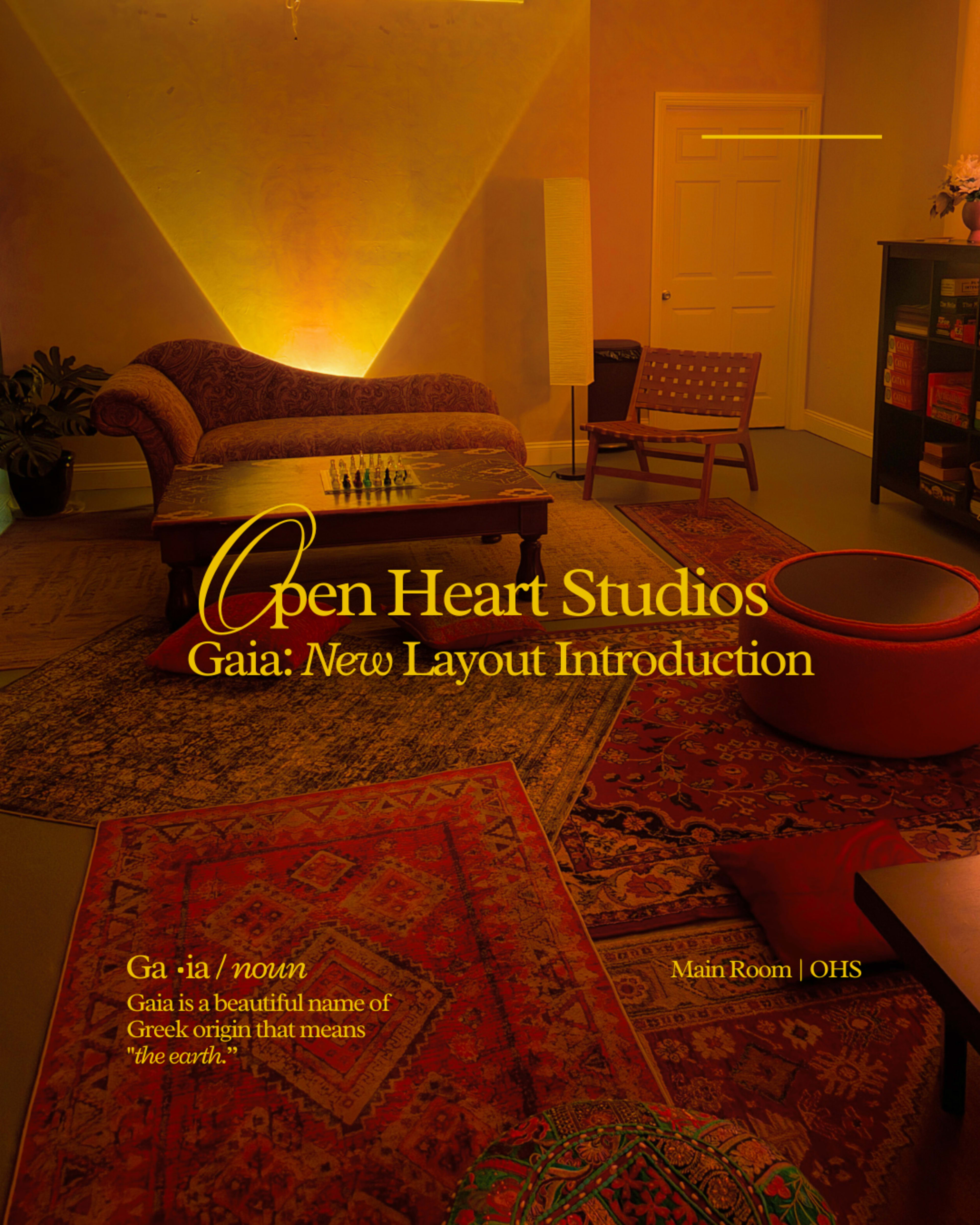 The image features a warmly lit main room of Open Heart Studios, showcasing a cozy lounge area with a patterned rug and bookshelves.