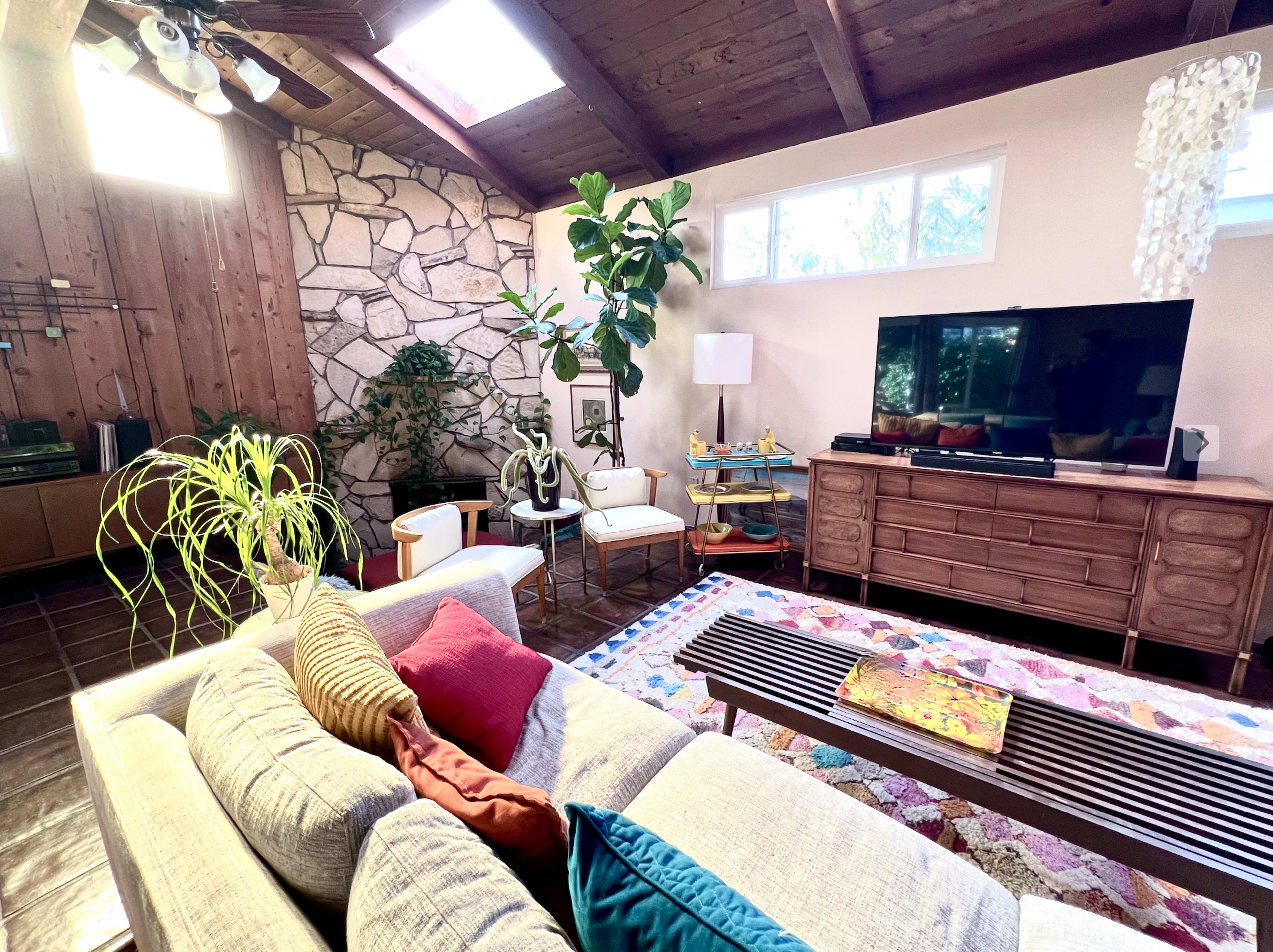 Colorful Midcentury Vaulted Family Room w/Bar, Sunken Fireplace, 50s/60s Decor, Greenery, Natural Light Image in Sunset Park, Santa Monica, CA