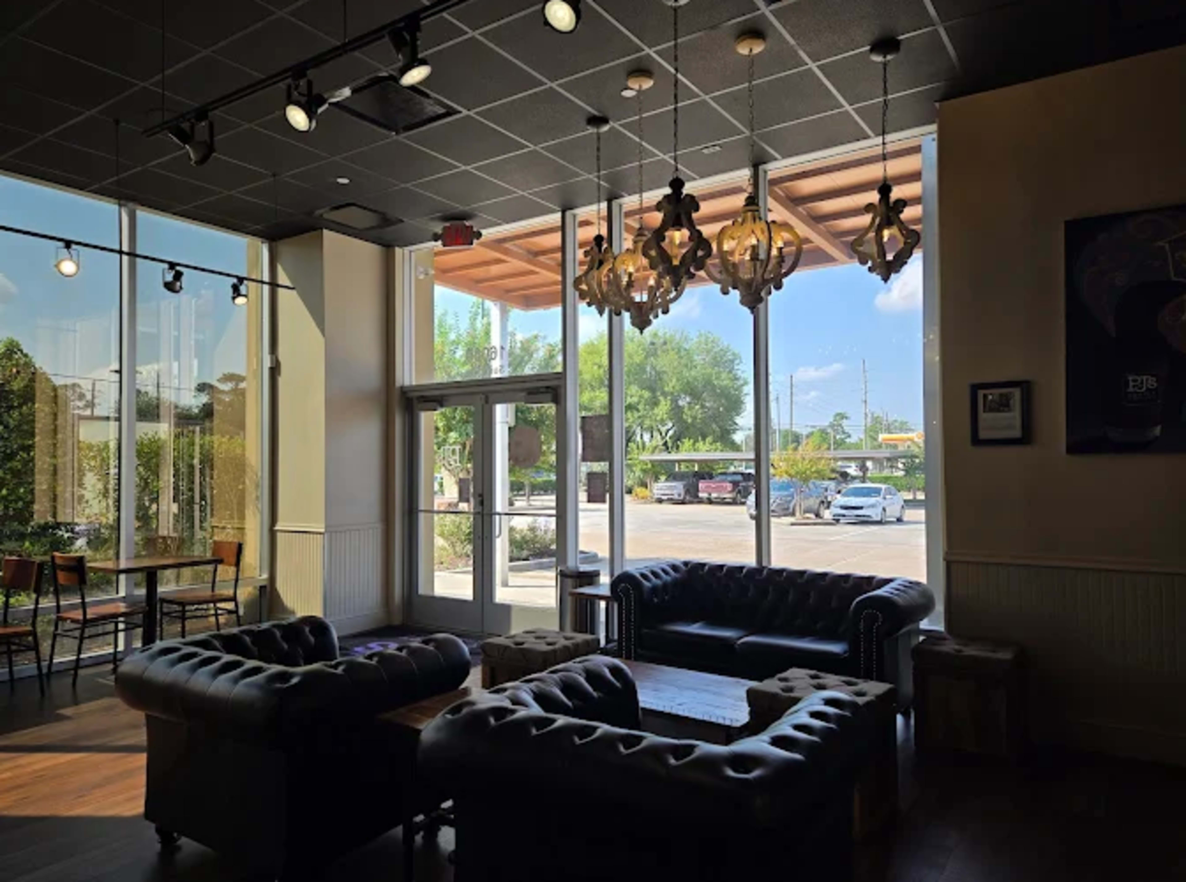Coffee shop with modern furniture and decor . New Orleans themed vibe so music and happiness are always welcomed Image in , Spring, TX