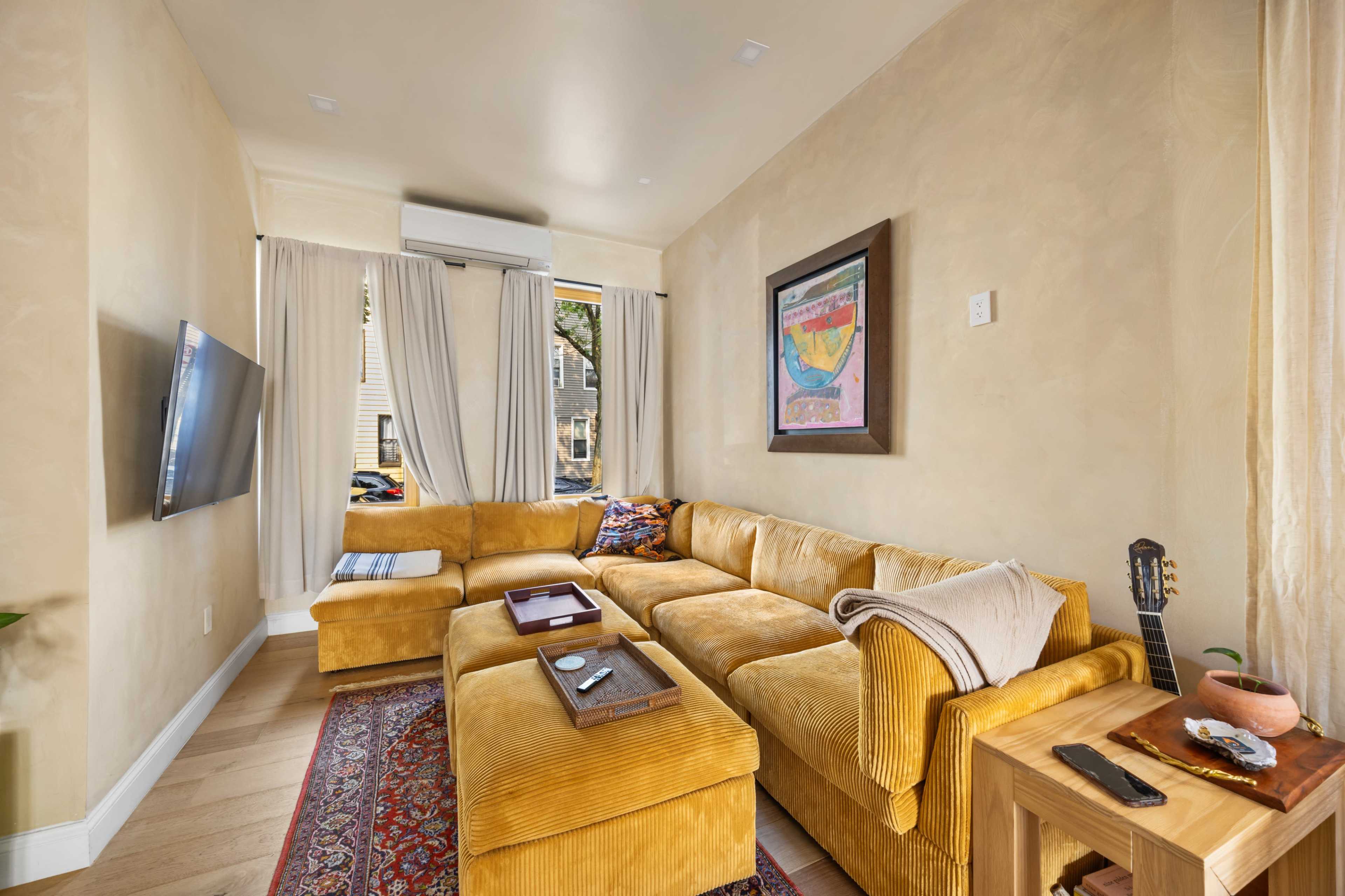 Mediterranean Townhouse with Chic Backyard Image in Ridgewood, Queens, NY