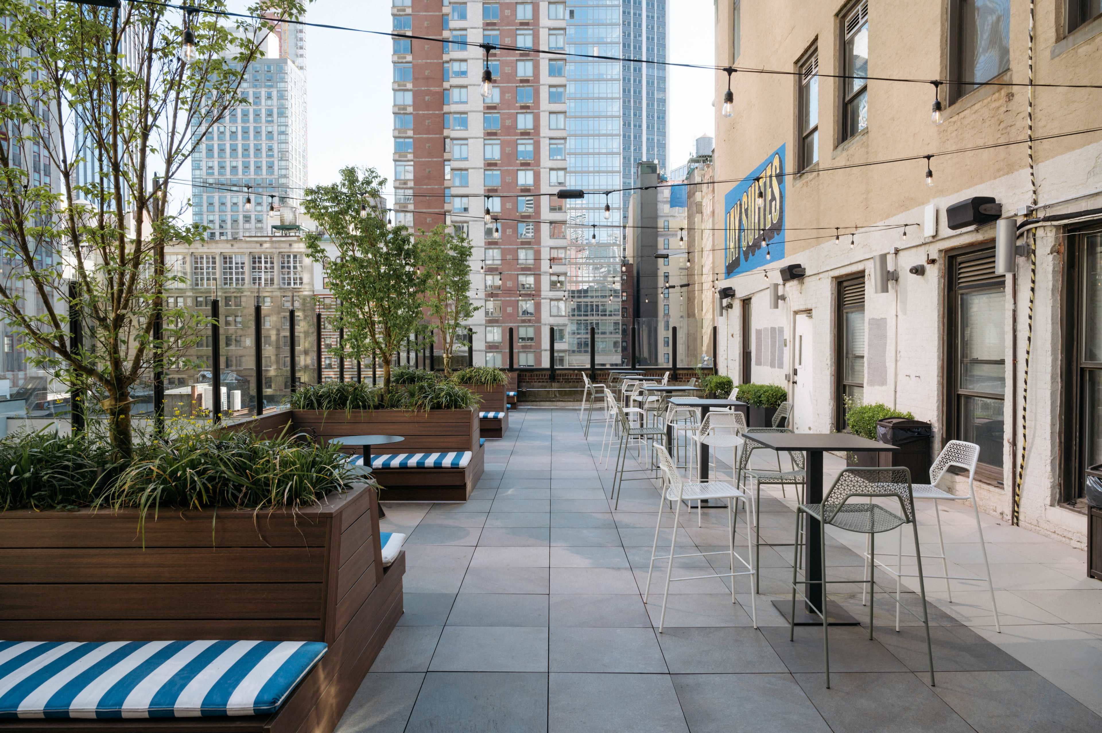Amazing 2,000 SF Rooftop Terrace in Midtown Overlooking the Empire State Building with Sound System, Seating & Displays - Easy Access from Penn Station Image in Midtown, New York, NY