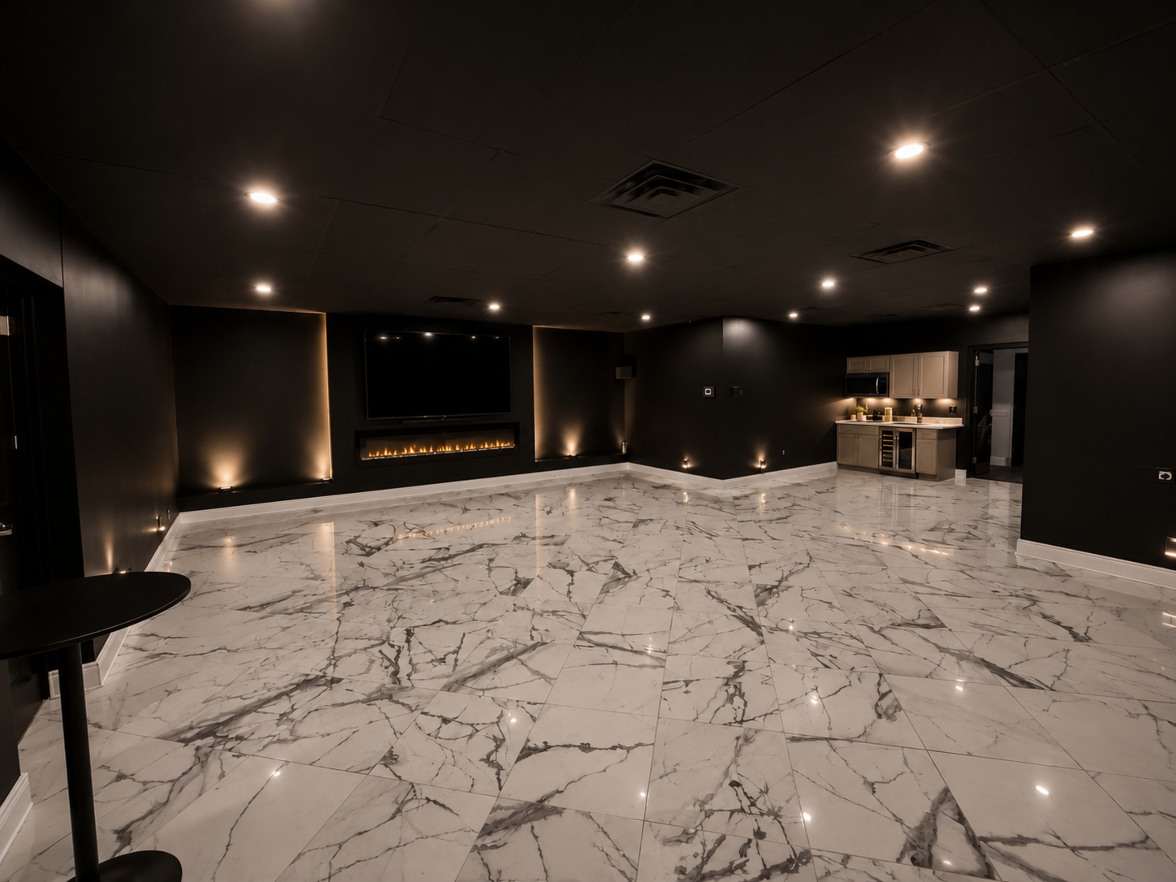 The image shows a spacious, modern room with a glossy marble floor, wall-mounted television, and ambient lighting.