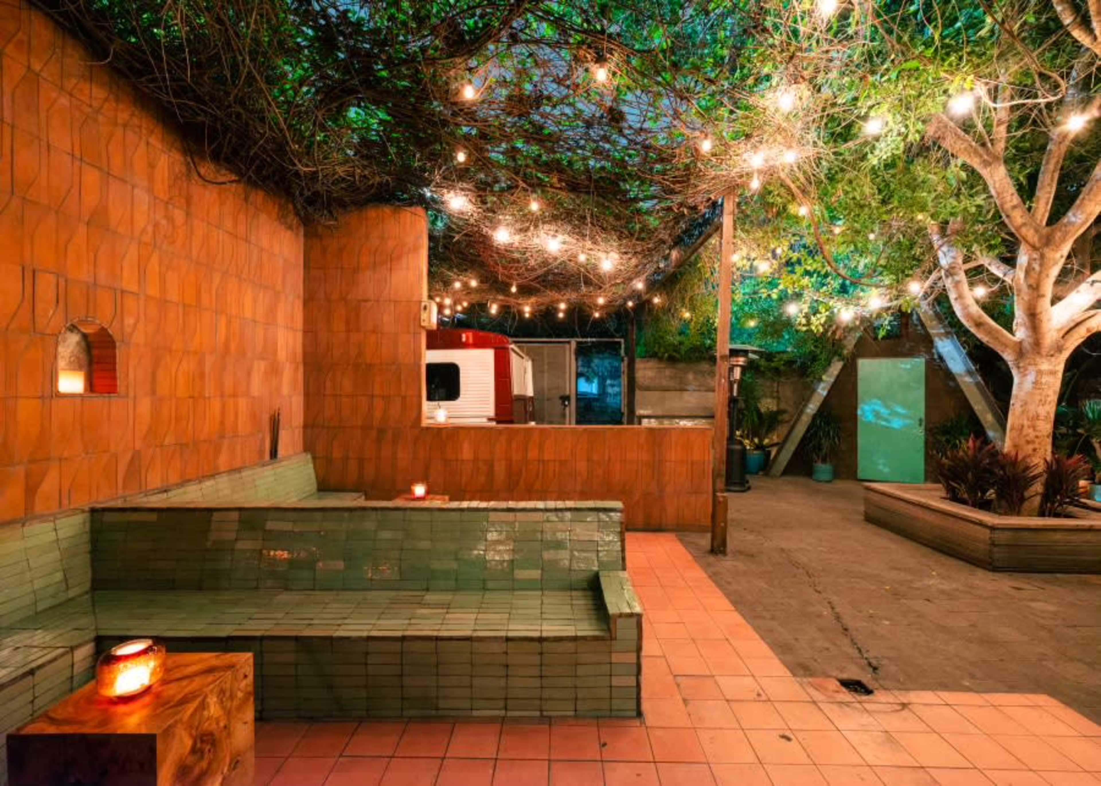 indoor outdoor patio bar with lush greenery and vine trellised canopy Image in Silver Lake, los angeles, CA