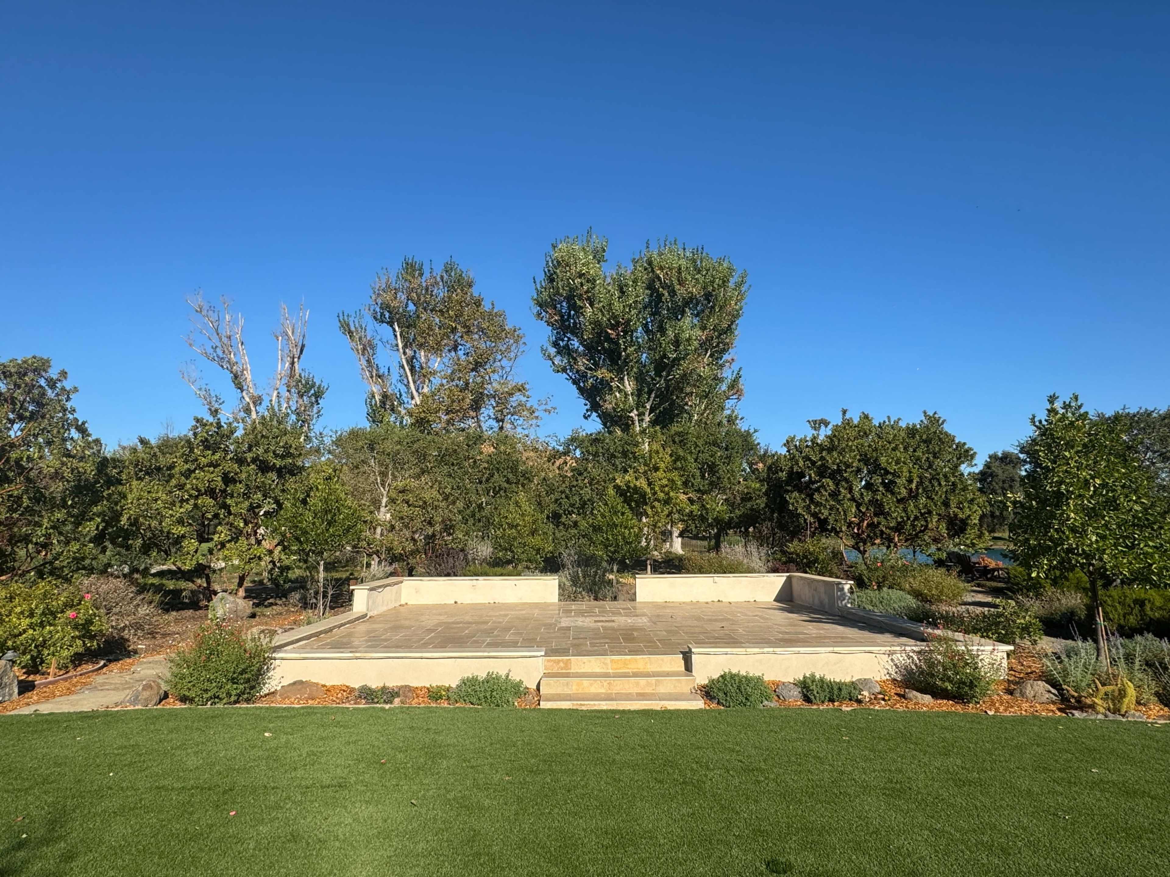 Large Tuscany outdoor with patio overlooking vineyards, mountains and lakes. Image in San Martin, San Martin, CA