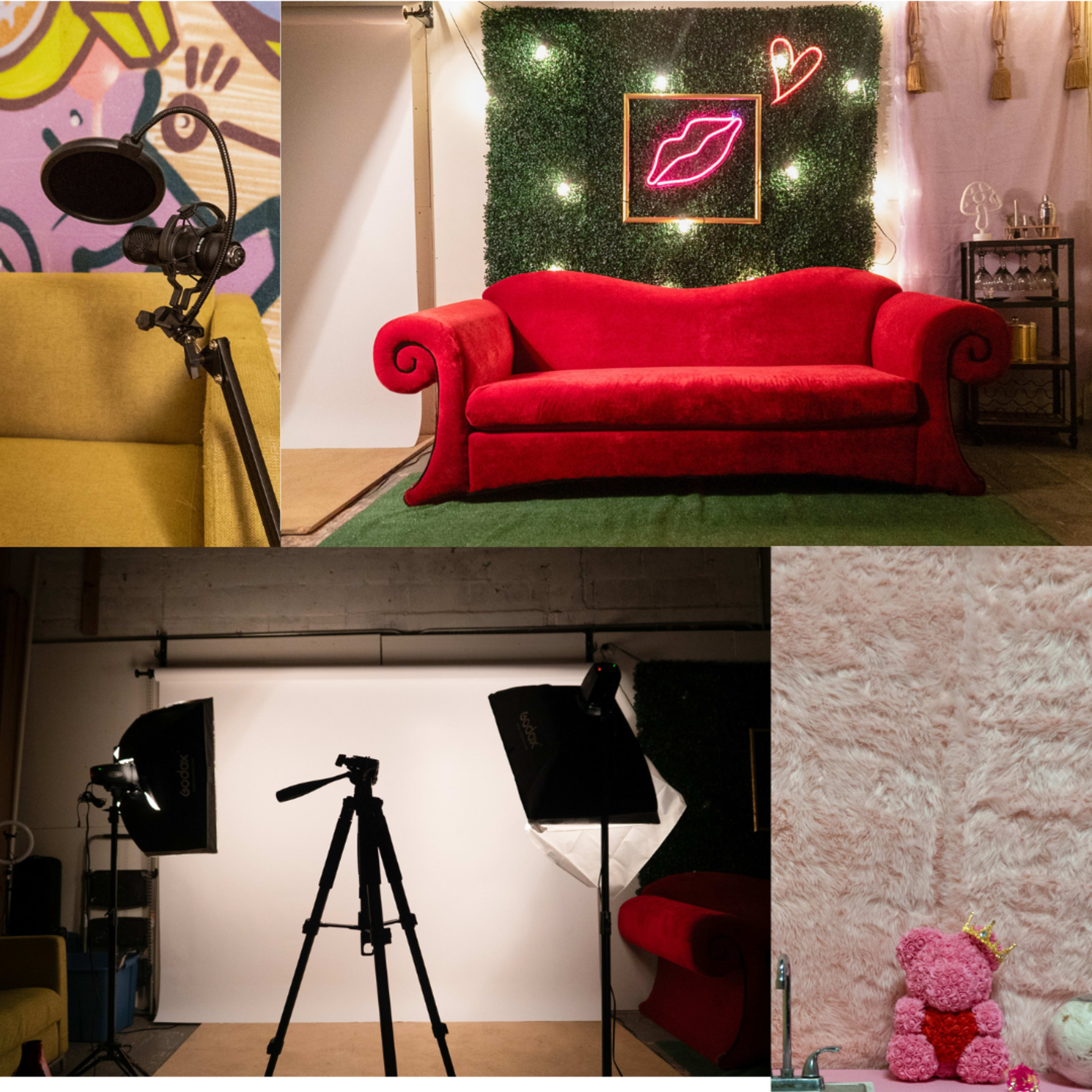 The image showcases a styled studio space featuring a red couch surrounded by decorative greenery, a microphone on a stand, studio lights, a tripod, and a plush pink teddy bear on a soft surface.