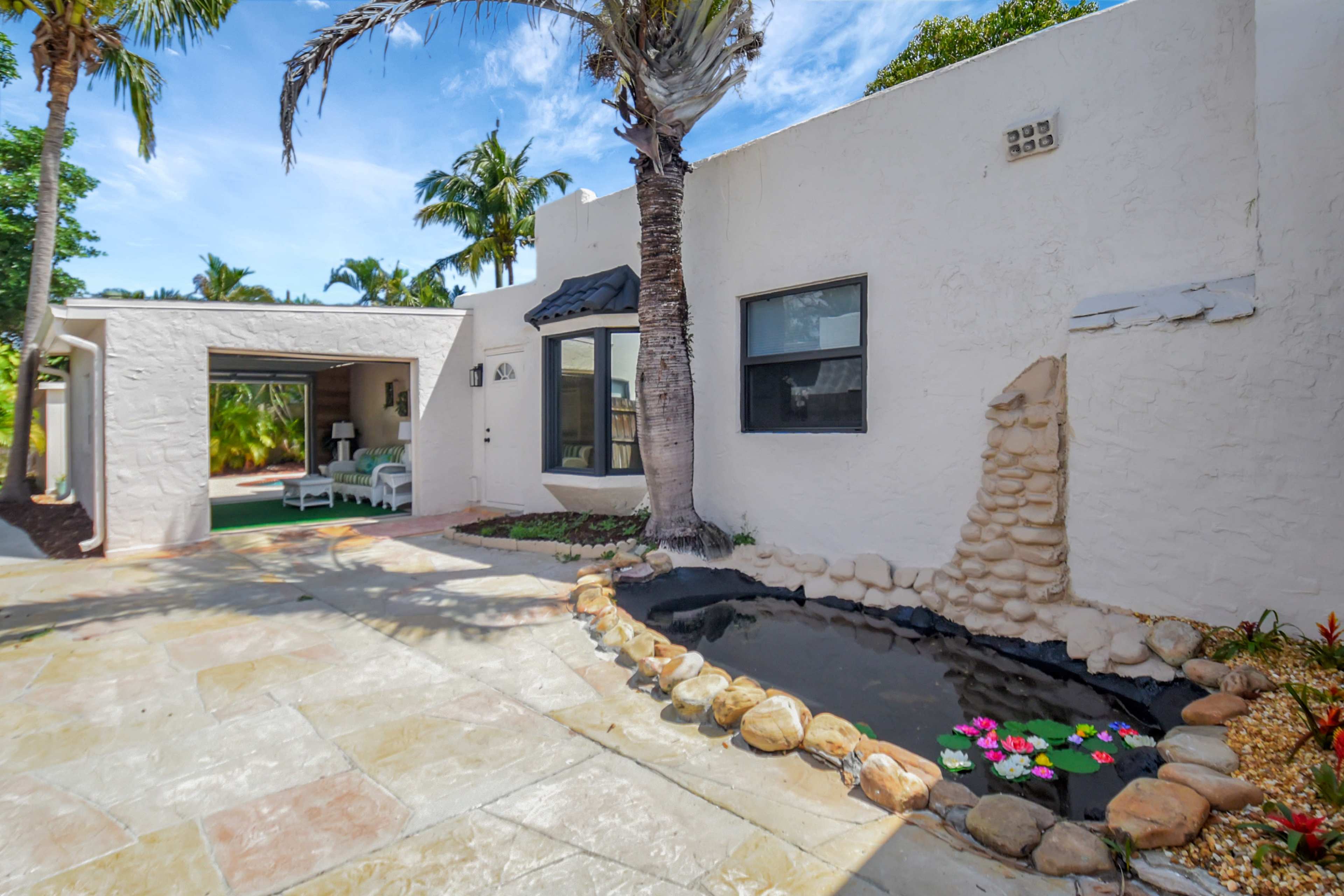 West Palm Beach Oasis | Private Pool Retreat & Open Air Lounge | King Bed & 2 Queen Beds | Grill | TheLiliPad Image in Parker Ridge, West Palm Beach, FL