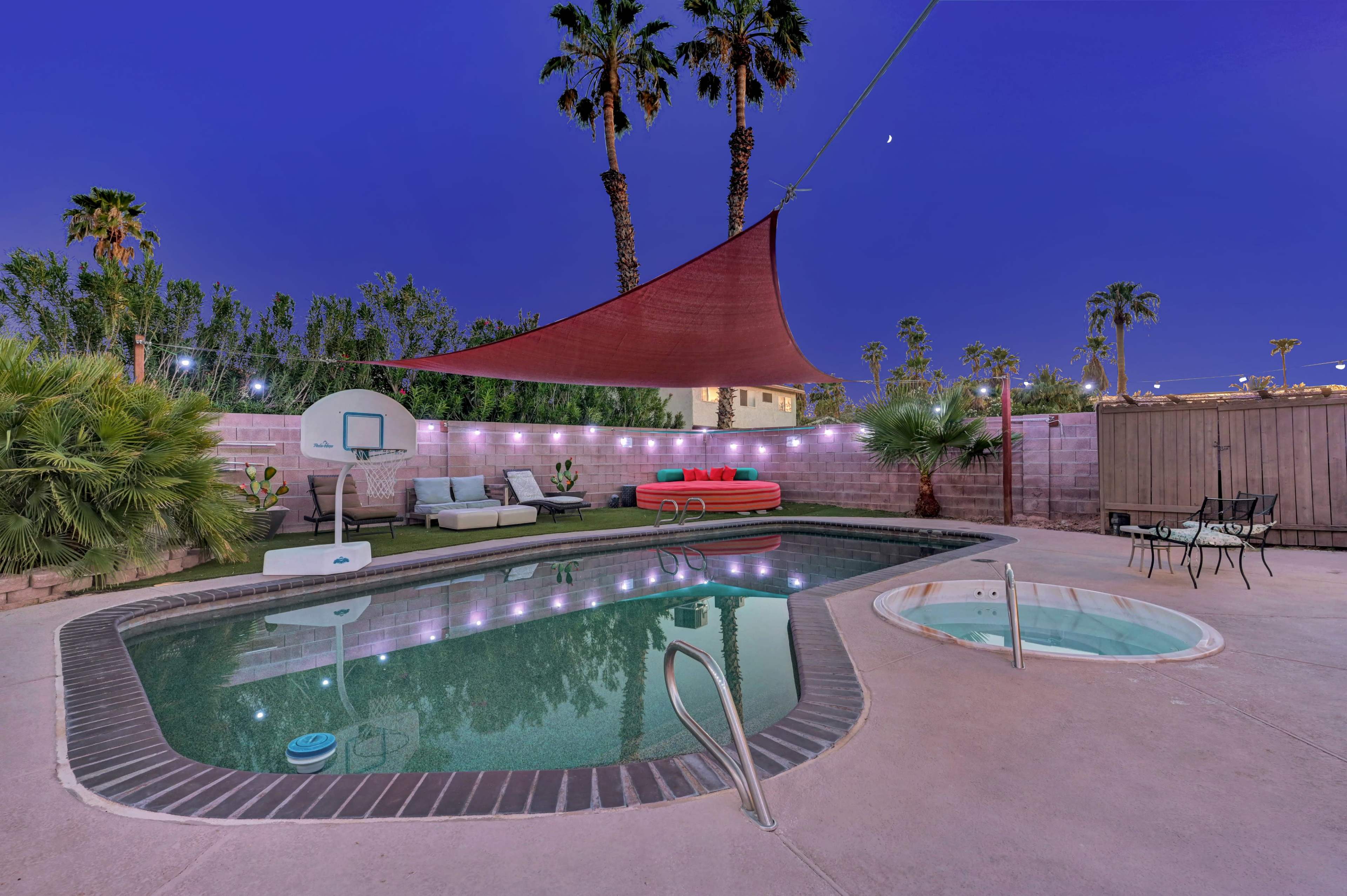Oasis backyard with putting green, pool/spa/patio area/color string lights etc. Image in Spring Valley, las vegas, NV