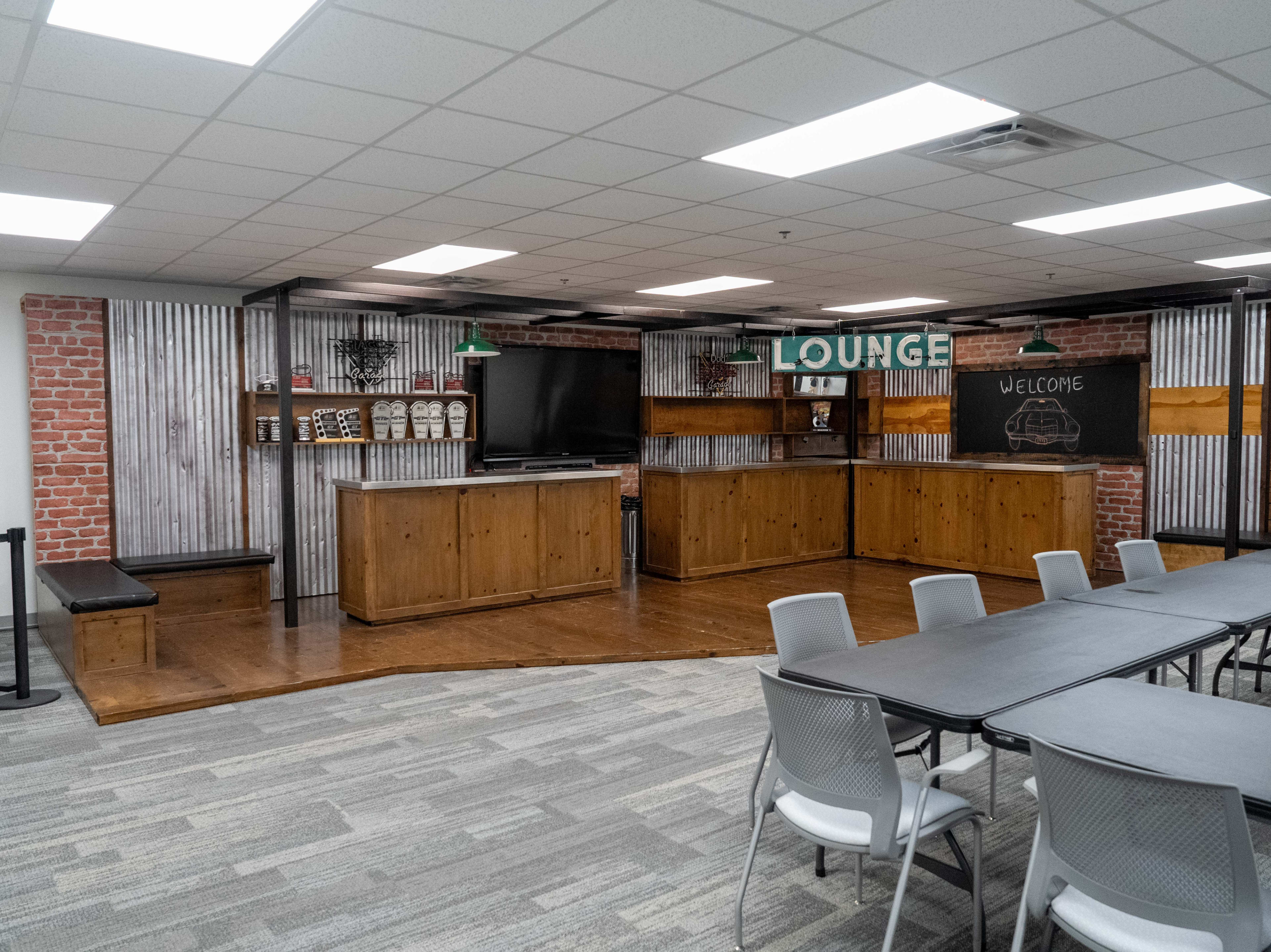 Modern Meeting Lounge with Rustic Bar Backdrop Image in Franklin, Franklin, TN
