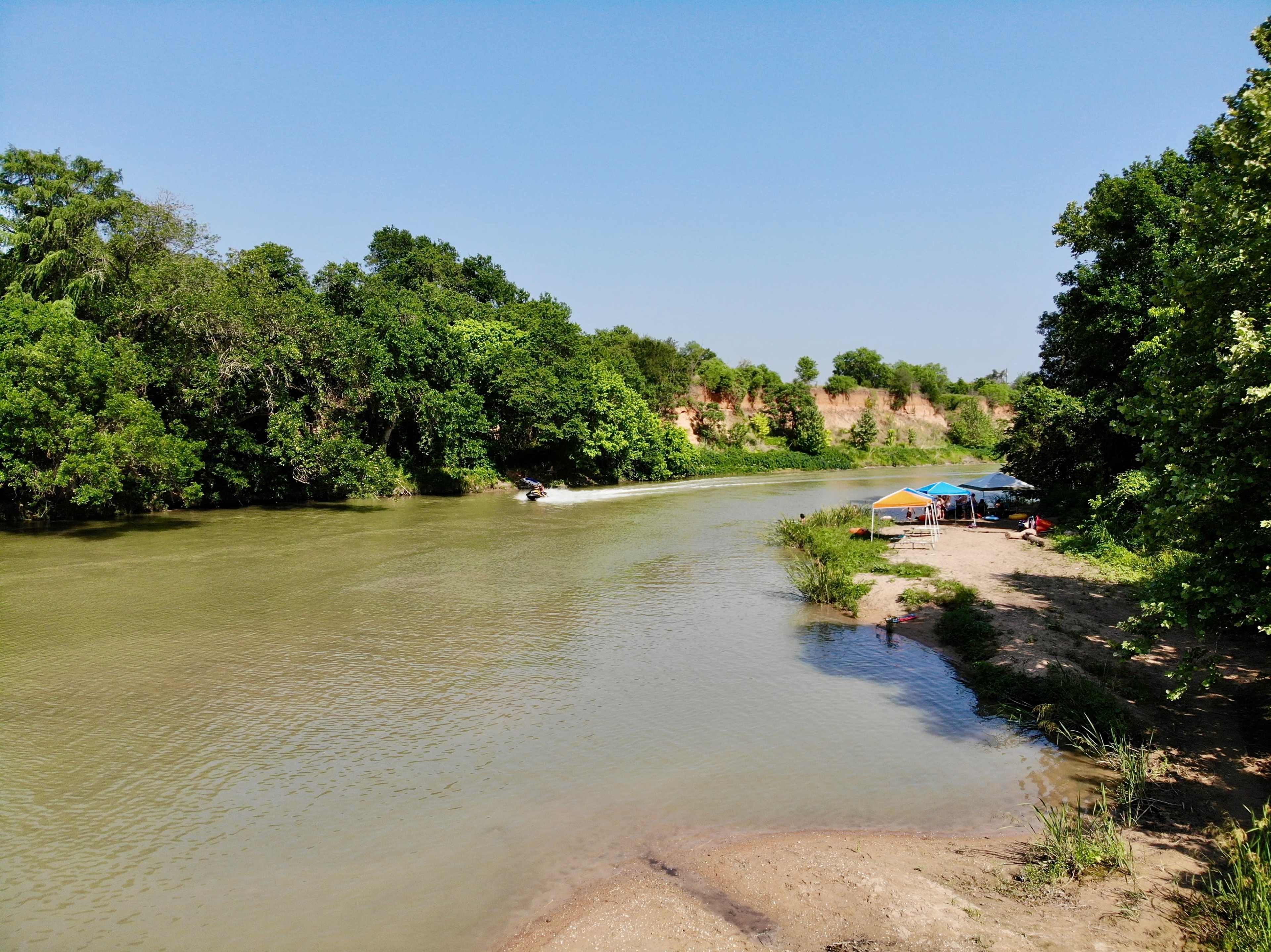 Lush Campground on the River just Outside of Austin. Image in River Timber, Del Valle, TX