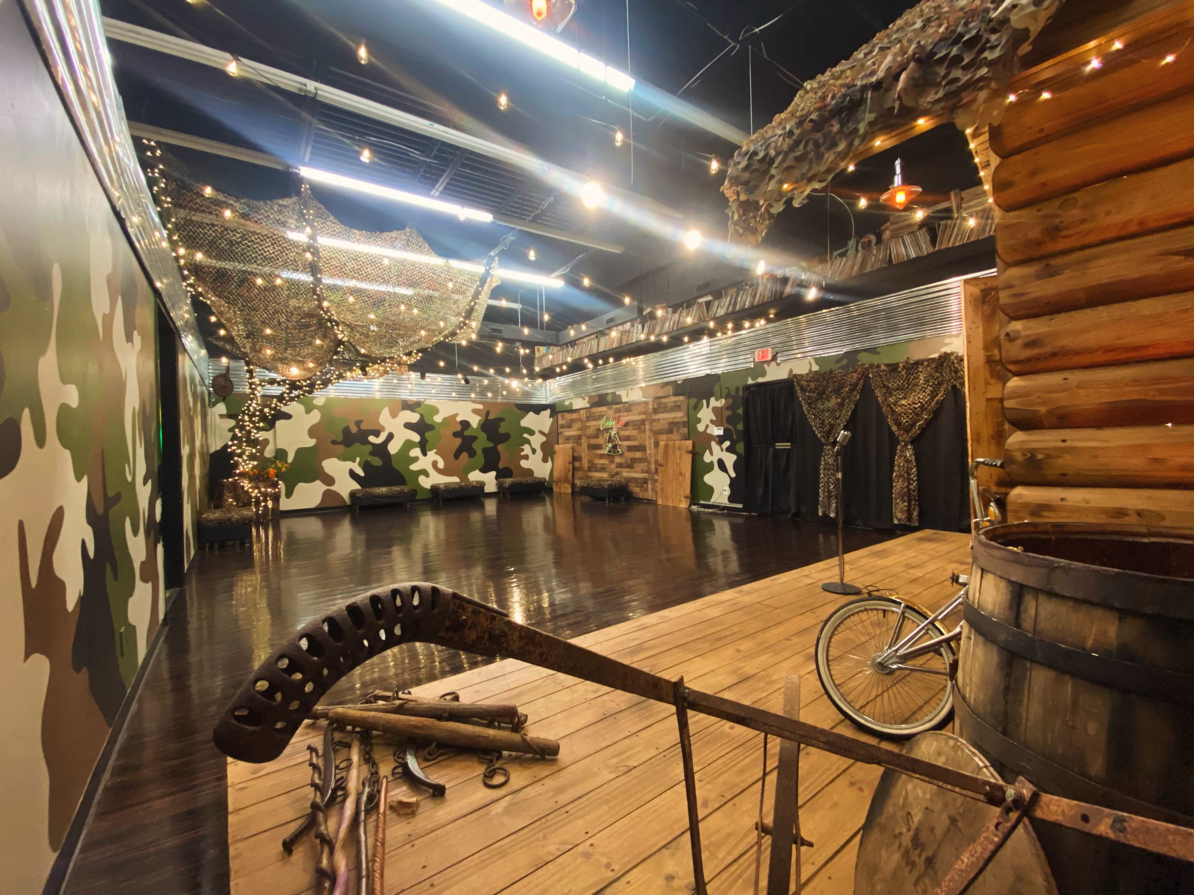 Indoor/Outdoor Ambience, prop log cabin with porch/stage, venue Image in Winston-Salem, Winston-Salem, NC