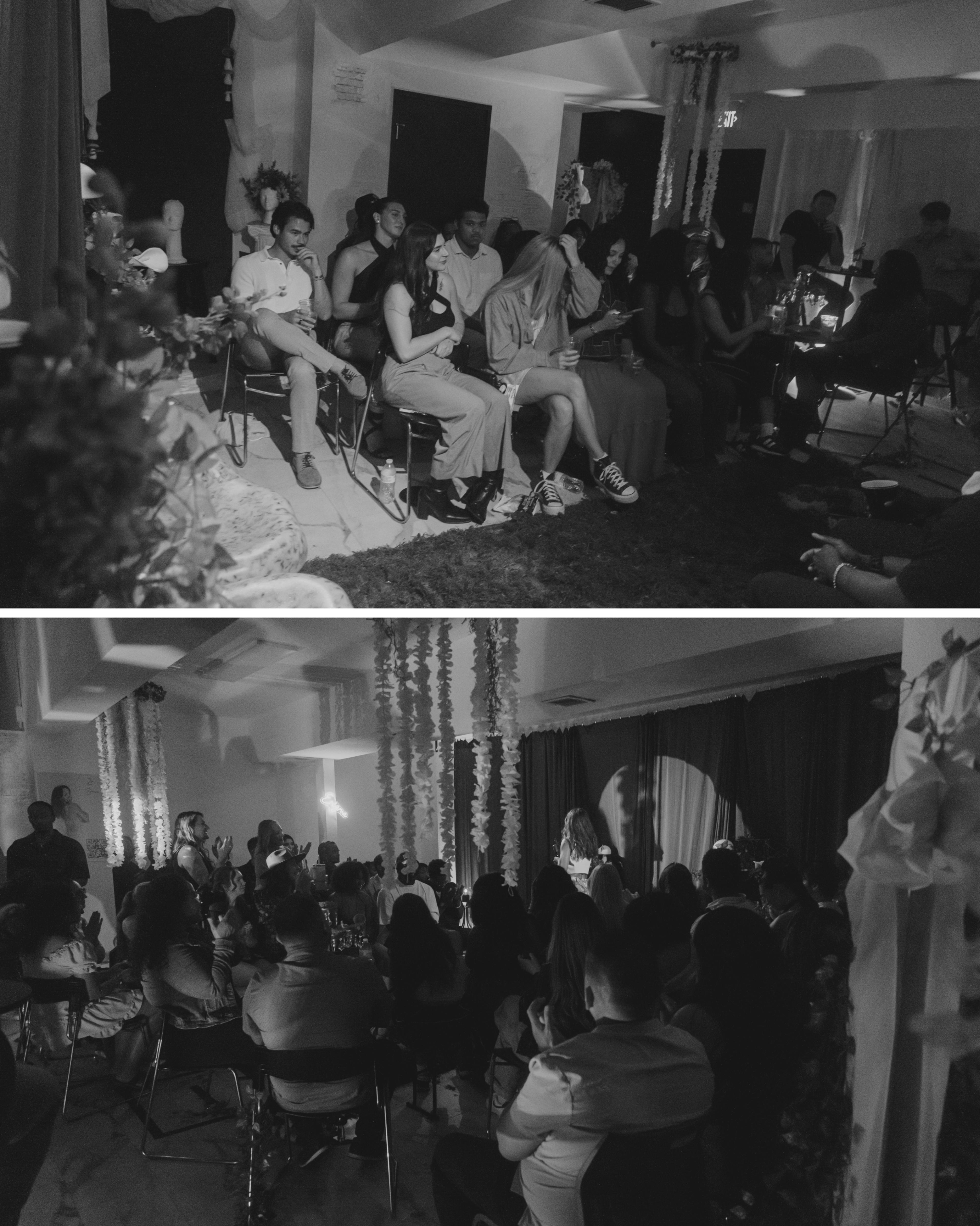A diverse group of people gathers in a dimly lit room, sitting on chairs and observing a performance or presentation at the front.