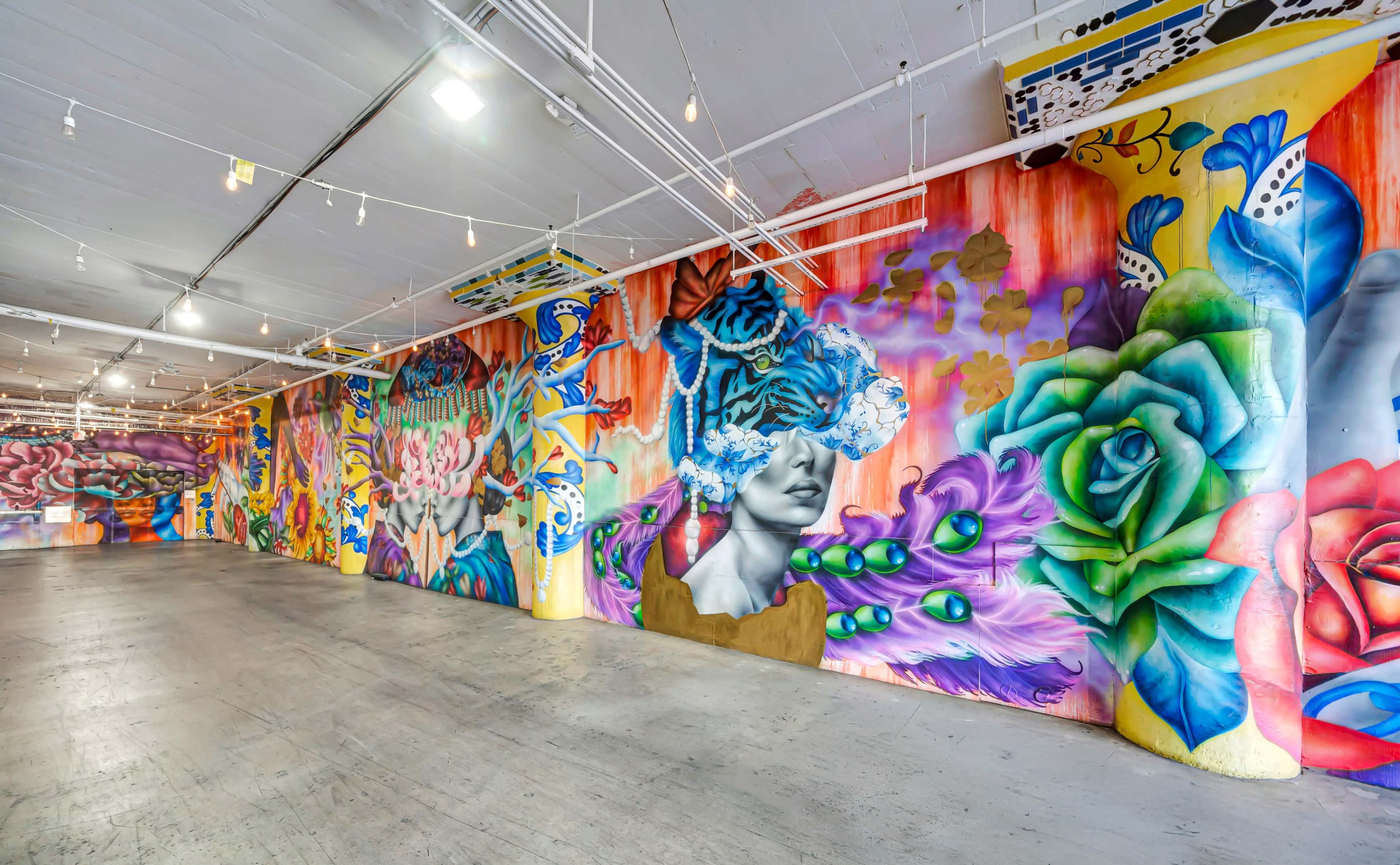 Immersive Industrial Corridor with Vibrant Floor-to-Ceiling Murals Image in Central LA, Los Angeles, CA