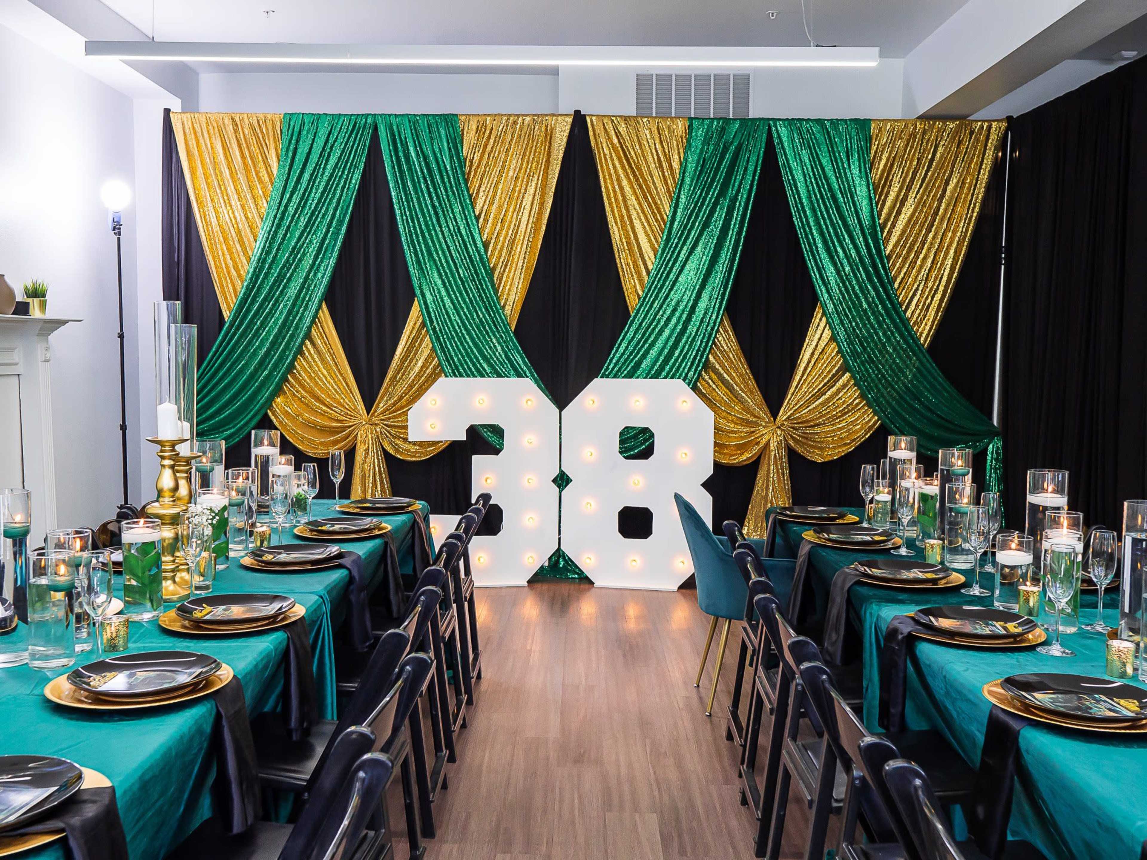 The scene features a decorated banquet room with green and gold drapes, illuminated large numbers "38" as a centerpiece, and elegantly set tables with black chairs and glassware.
