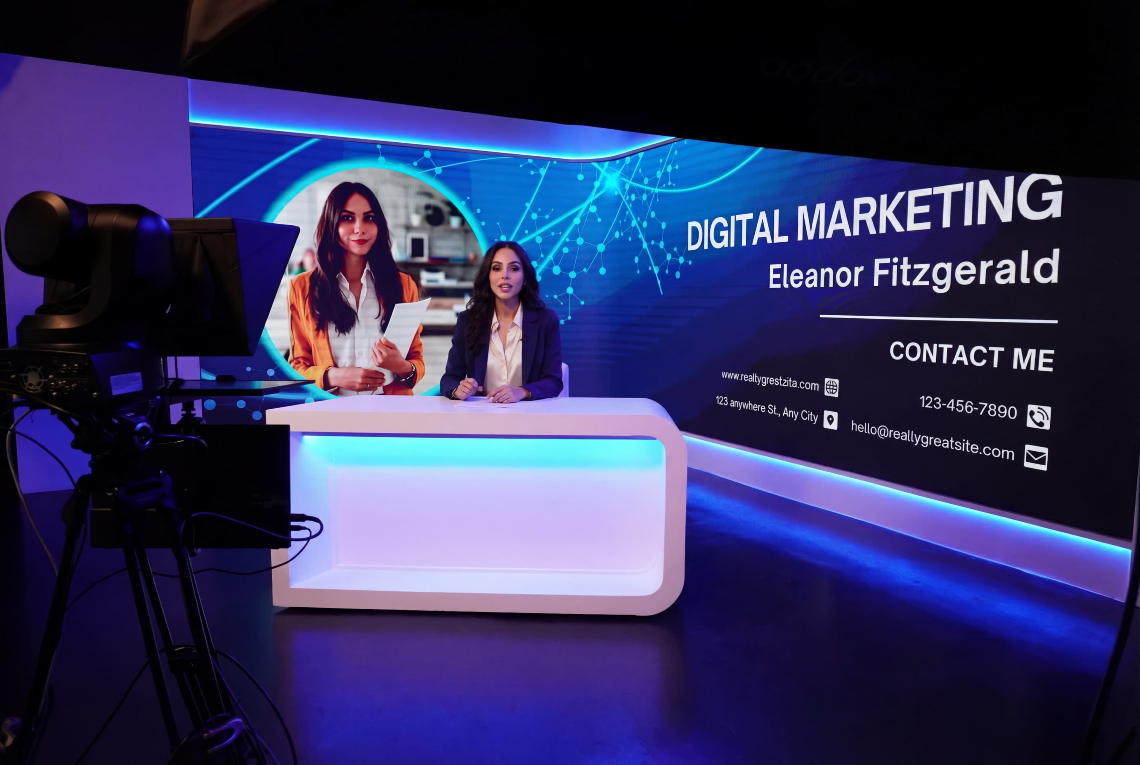 A woman sits at a modern desk in front of a digital screen displaying her name and contact information related to digital marketing.