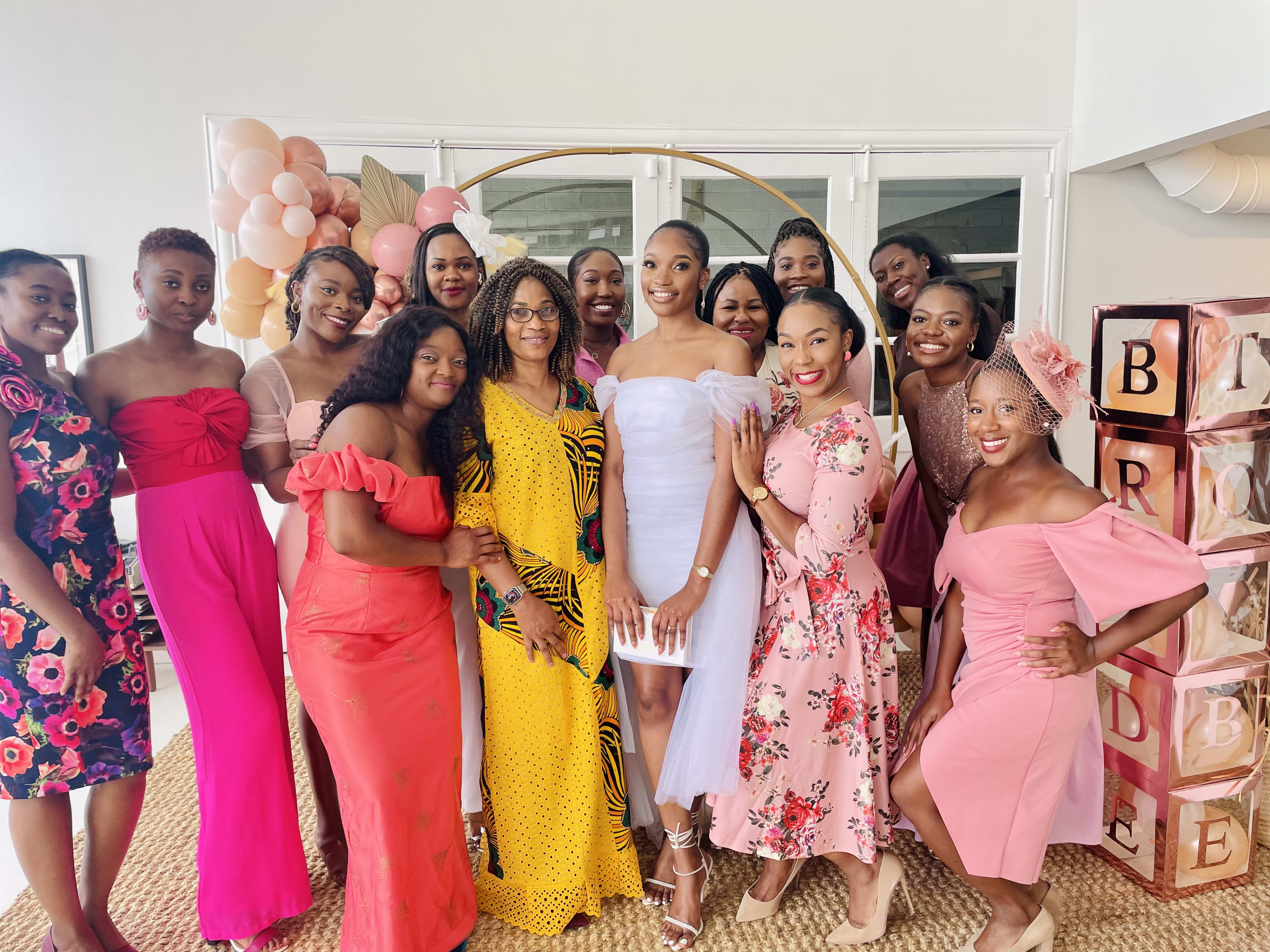 A group of women standing next to each other in a boho bridal shower.