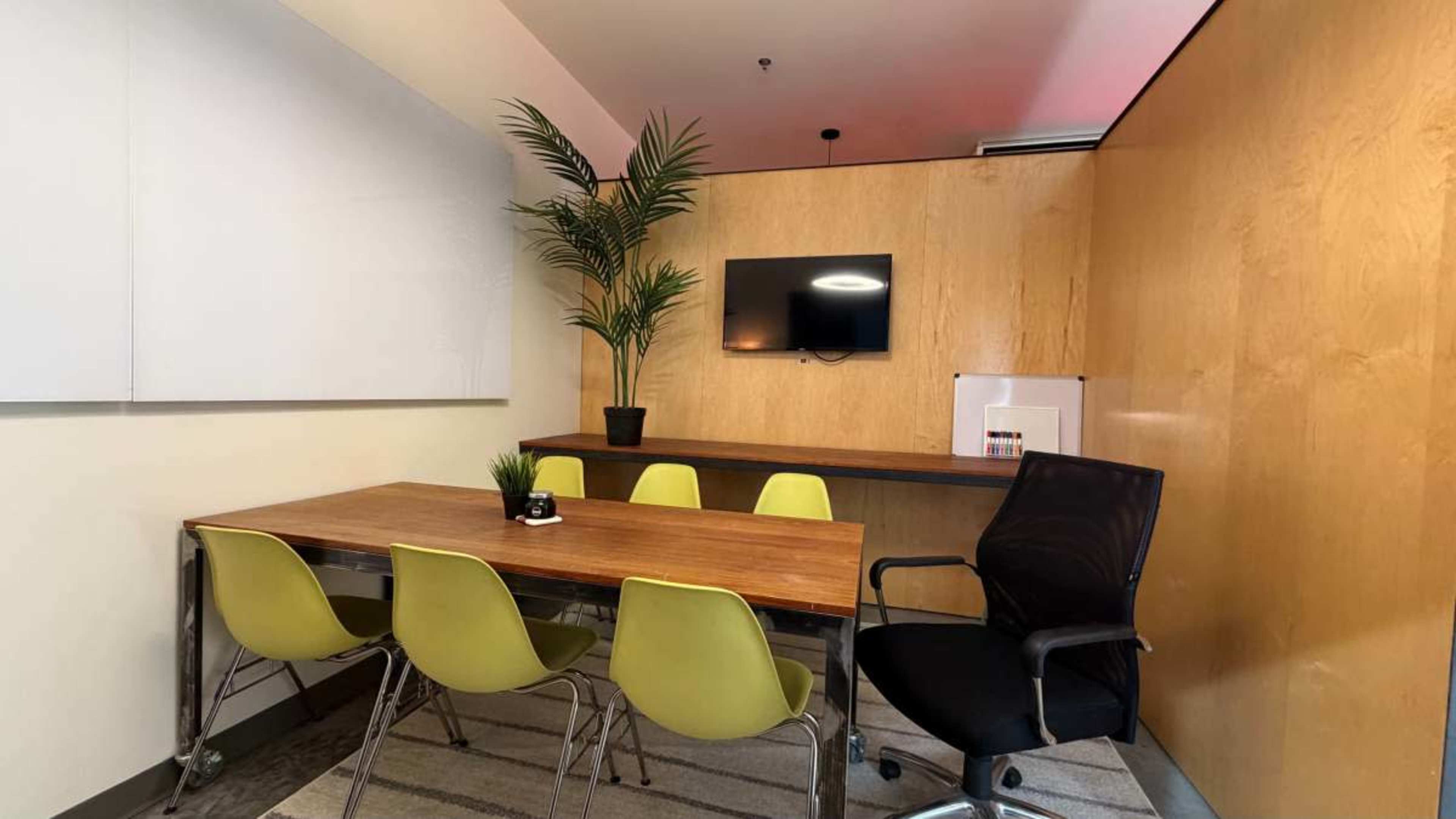 Modern Conference & Creative Meeting Room w/ Huge Glass Whiteboard, TV, & Couch Seating Image in Ballpark, Salt Lake City, UT