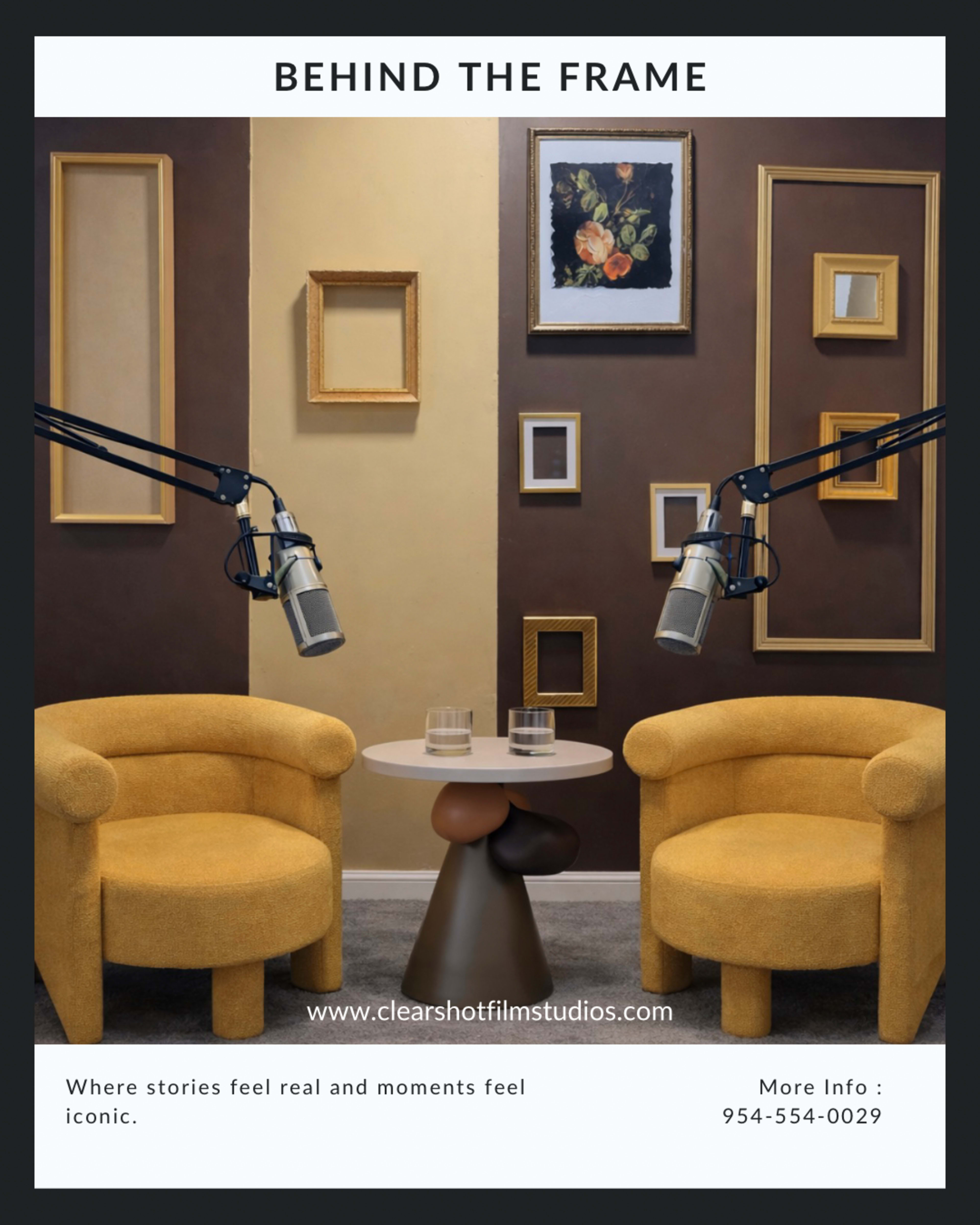 The image features two yellow armchairs positioned around a small table, with decorative frames on the wall behind them and microphones attached to stands.