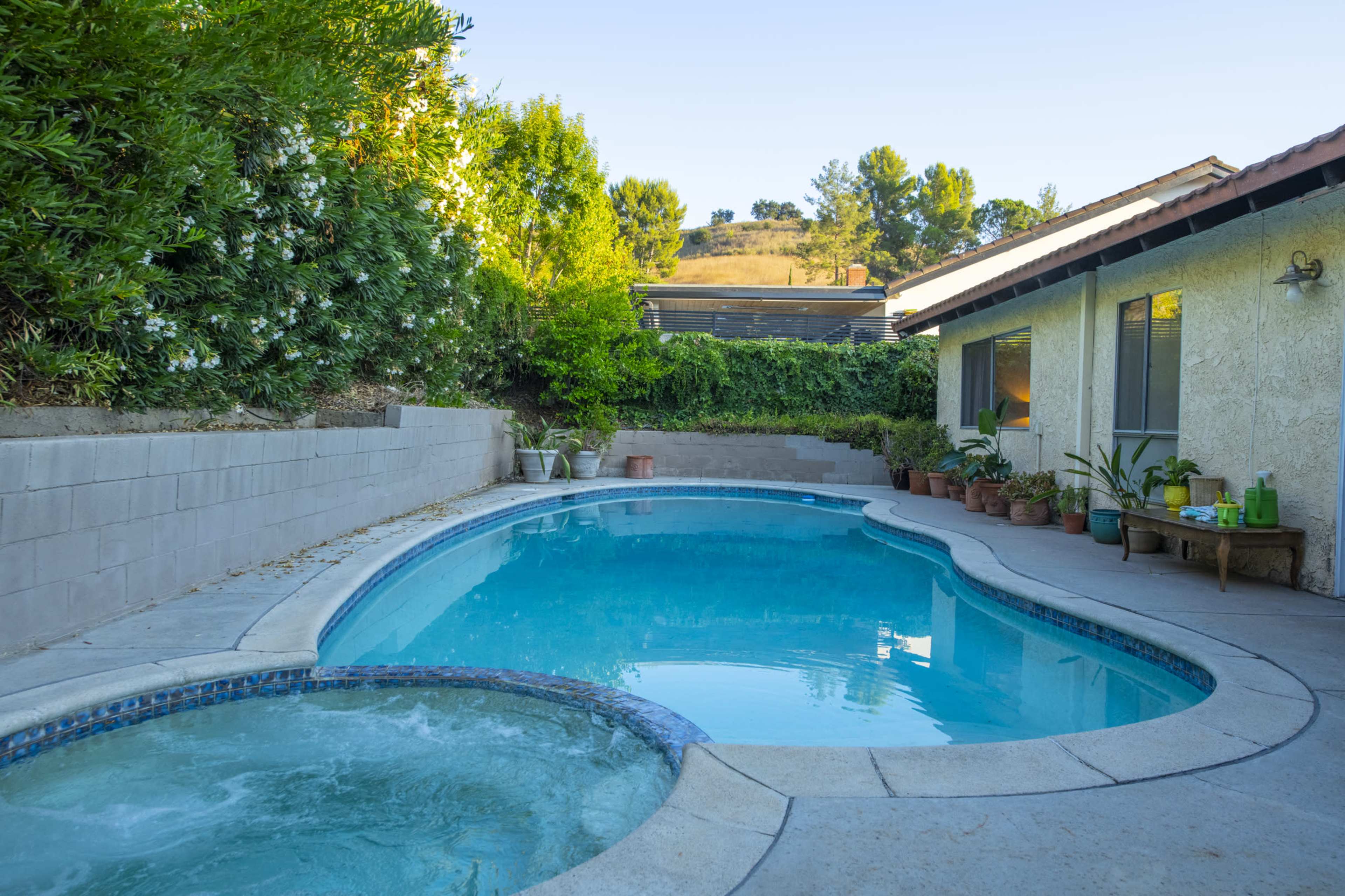 Mid-Century Ranch Oasis with Pool & Designer Interiors in Agoura Hills Image in Agoura Hills, Agoura Hills, CA