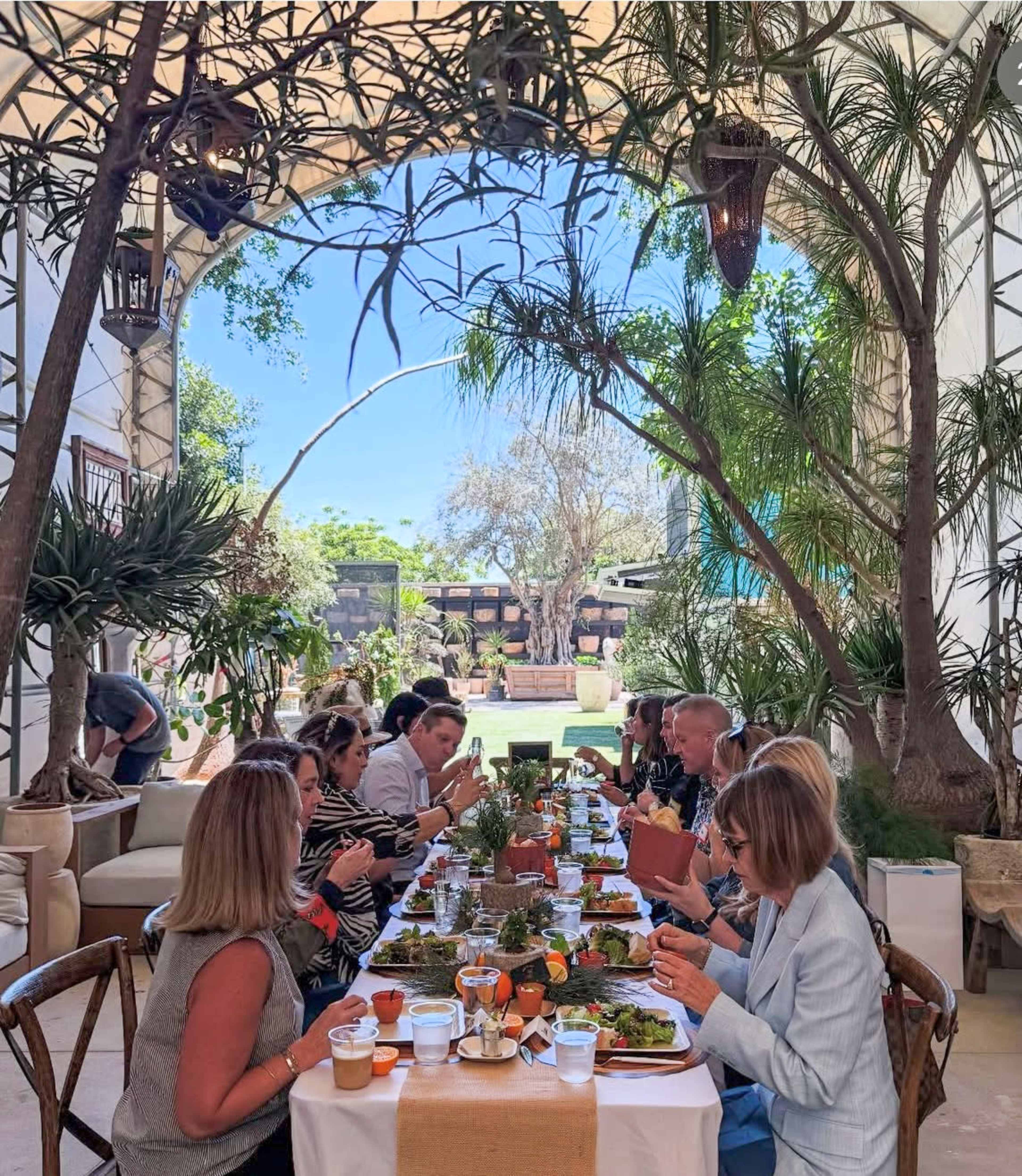Plant-Filled Greenhouse with Outdoor Gathering Area Image in East Irvine, Irvine, CA
