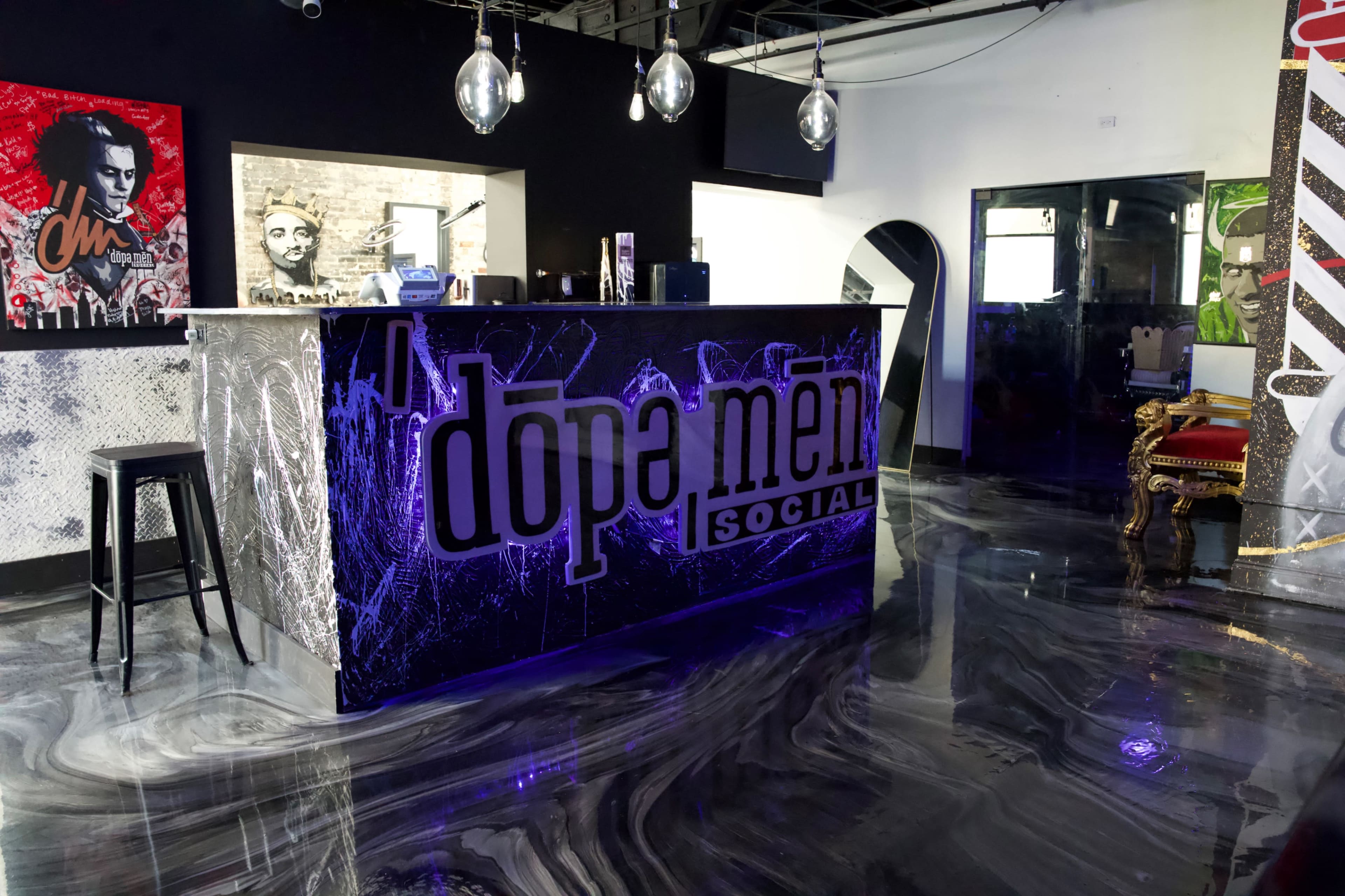 The image shows a modern bar area with a prominent "dope men social" logo on the counter, surrounded by artistic wall murals and stylish lighting fixtures.