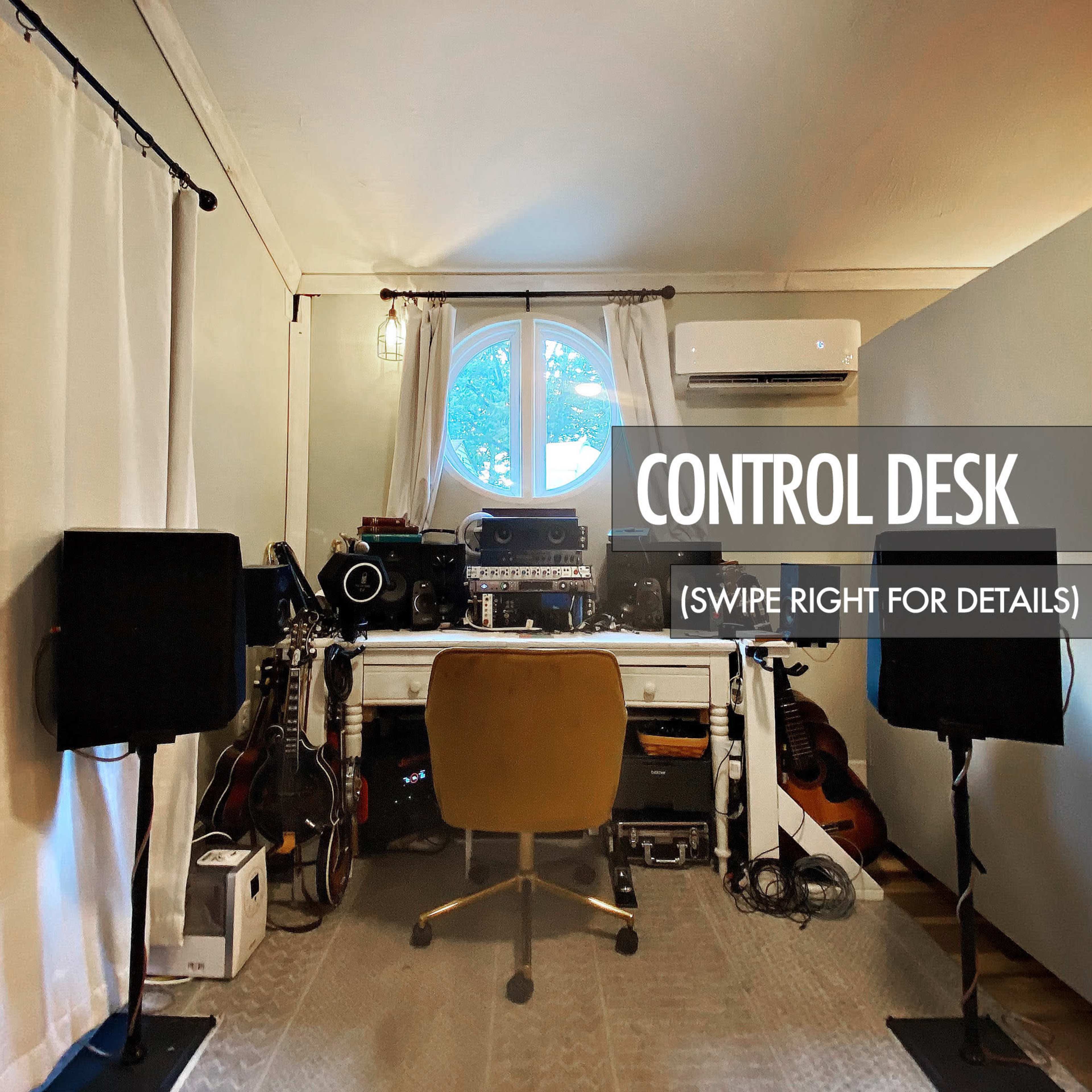 A home recording studio features a control desk at its center, surrounded by various musical instruments and audio equipment.