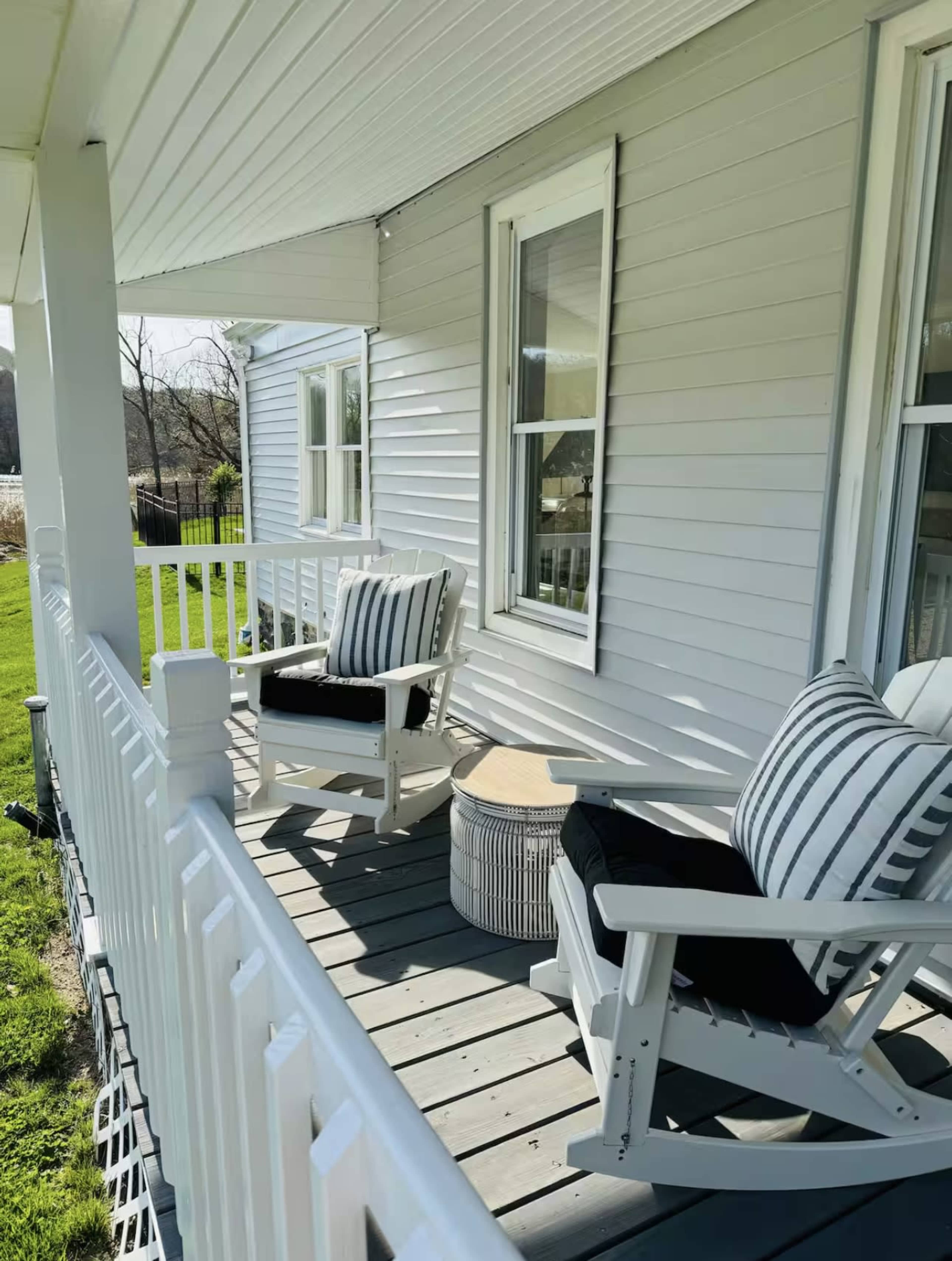 Modern farmhouse with a water view and pool on half an acre property Image in Riverhead, Wading River, NY
