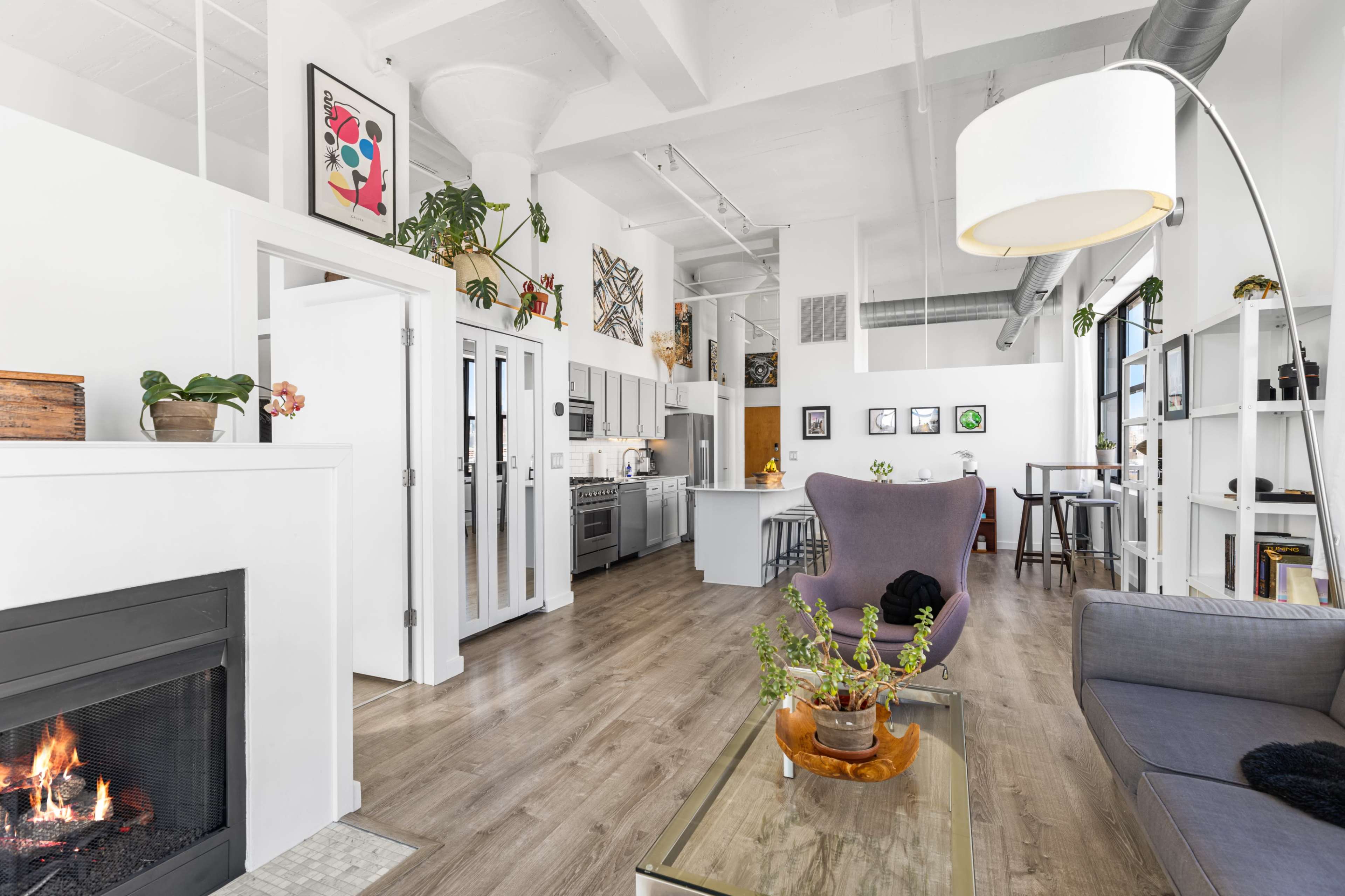 Modern & Historic Loft w/ 20ft Ceilings, South+East Facing Windows, Skyline Views, and Private Balcony Image in Near West Side, Chicago, IL