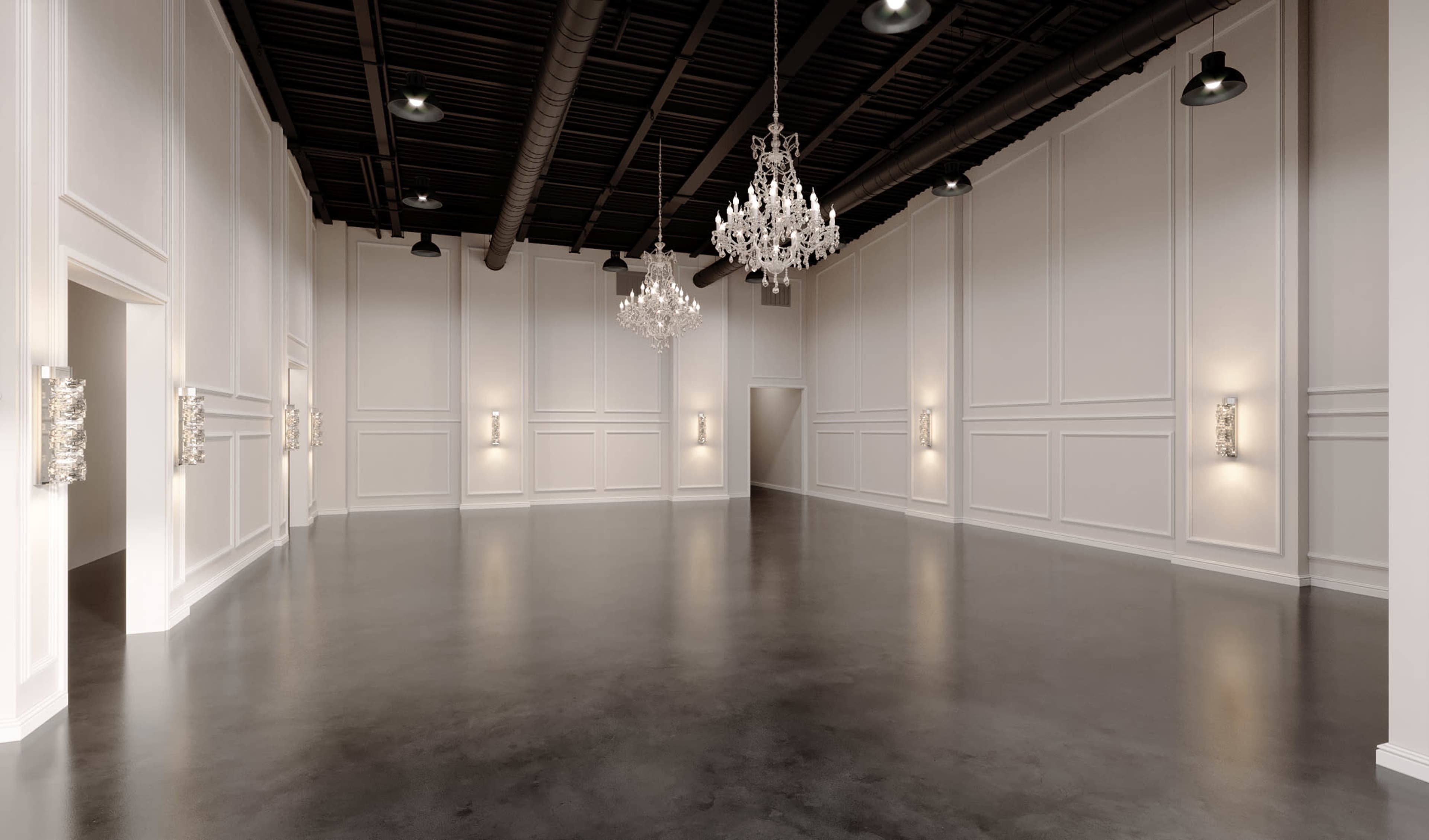 The image shows a spacious, elegantly designed room with high ceilings, adorned with chandeliers and wall sconces, featuring a polished concrete floor and white paneled walls.