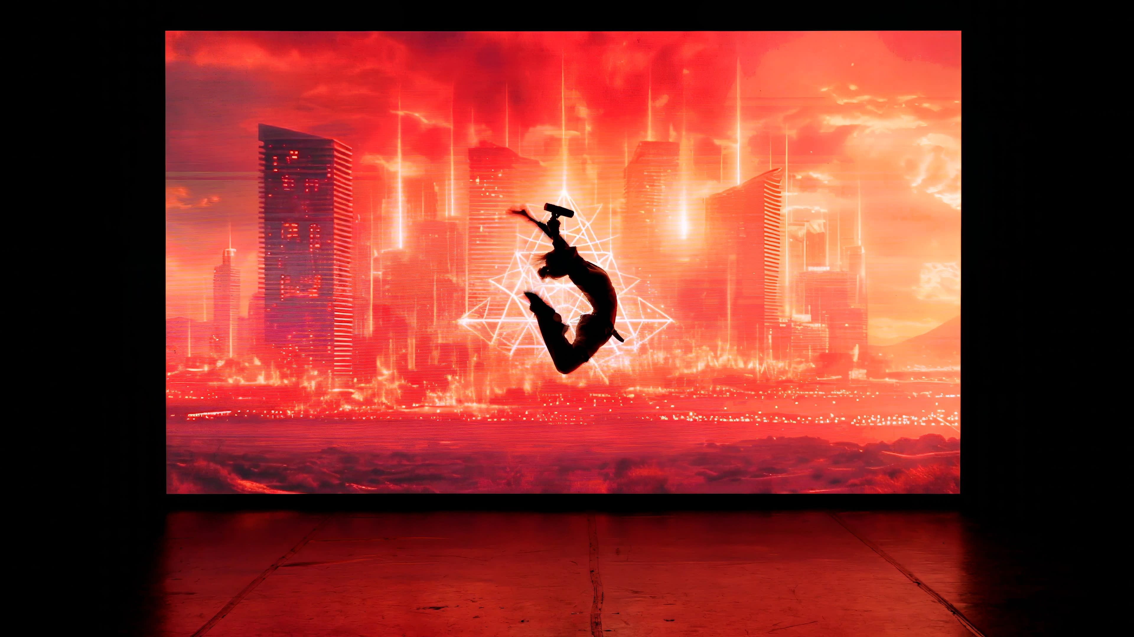 A silhouette of a figure leaps against a vibrant red backdrop featuring a futuristic city skyline.