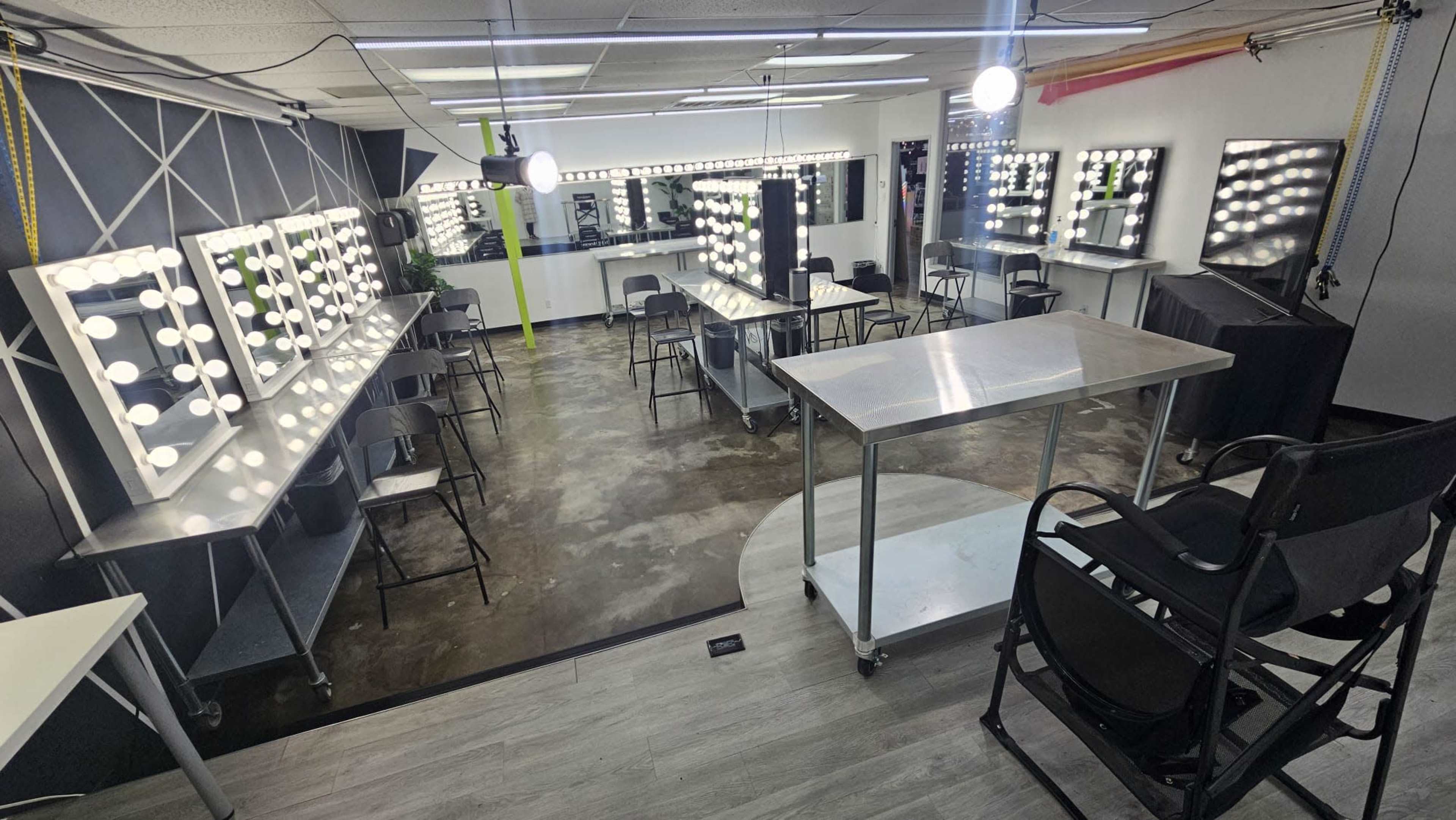 Clean, bright, open studio or classroom with Hollywood Vanities and barstool chairs Image in Westside, Houston, TX