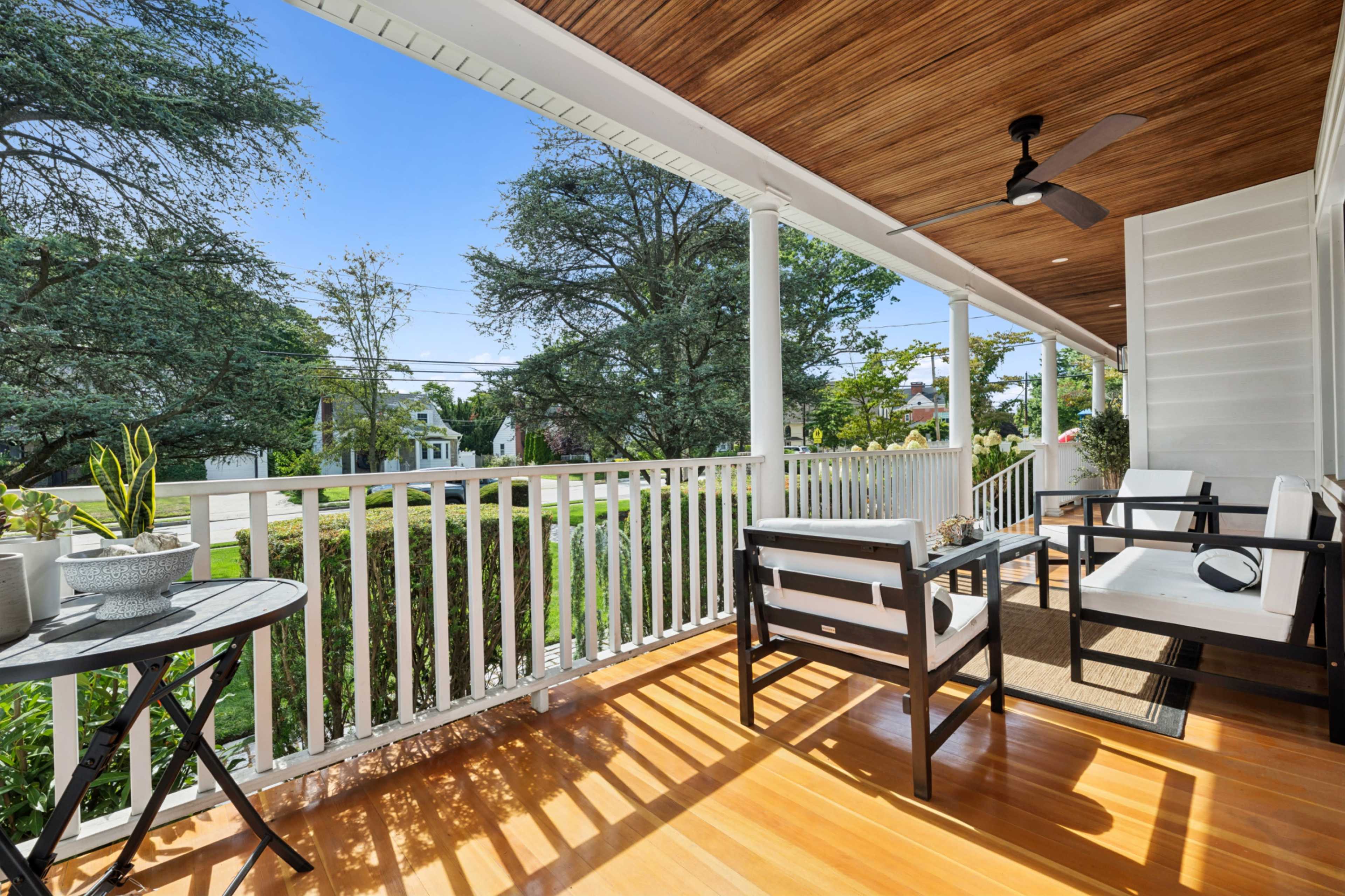 1913 updated and expanded Victorian center hall colonial on 1/3 acre property with wrap around porch. Image in Hempstead, West Hempstead, NY