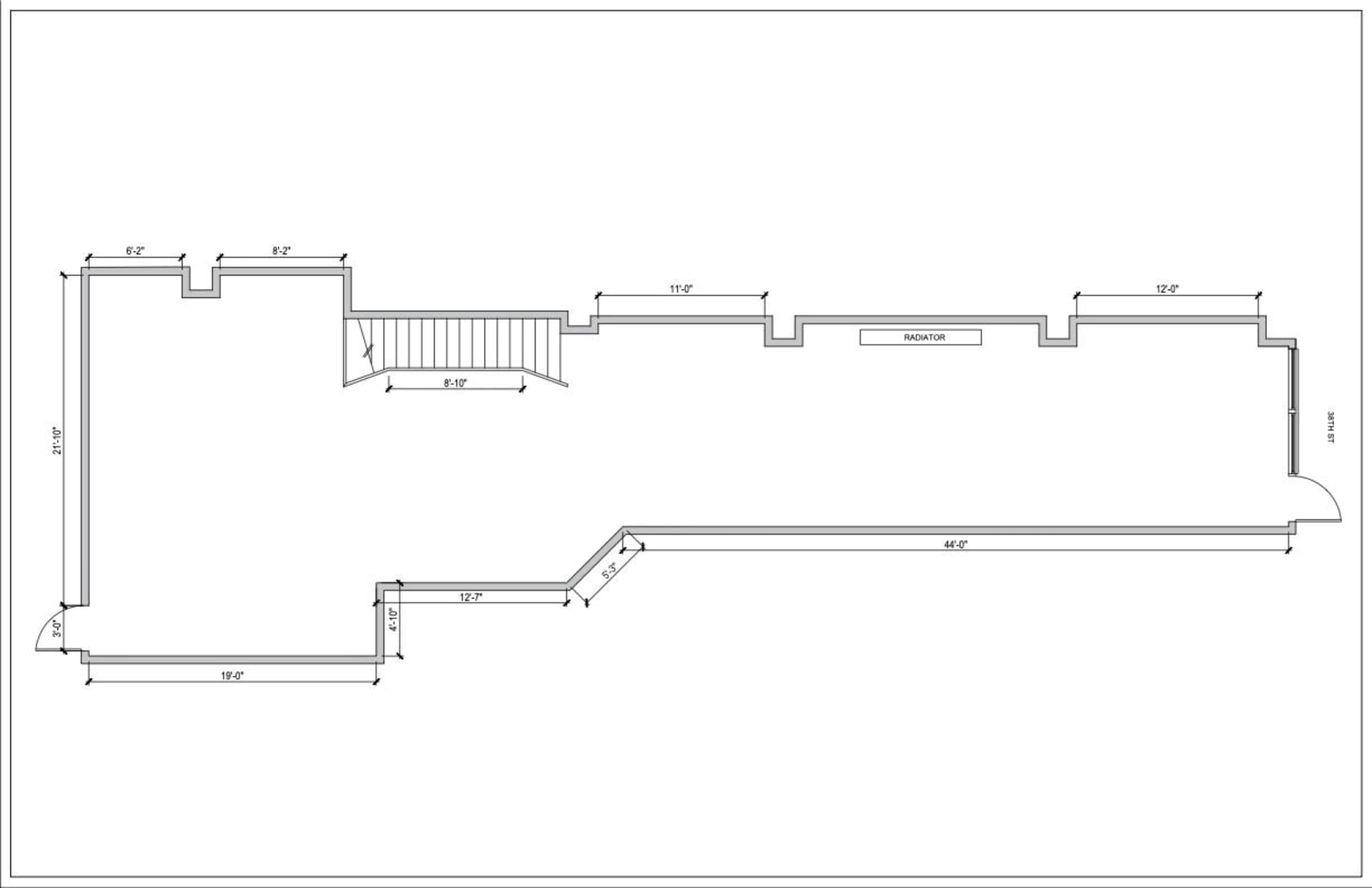 The image is a floor plan of a building, showing various rooms and dimensions including staircases and a hallway.