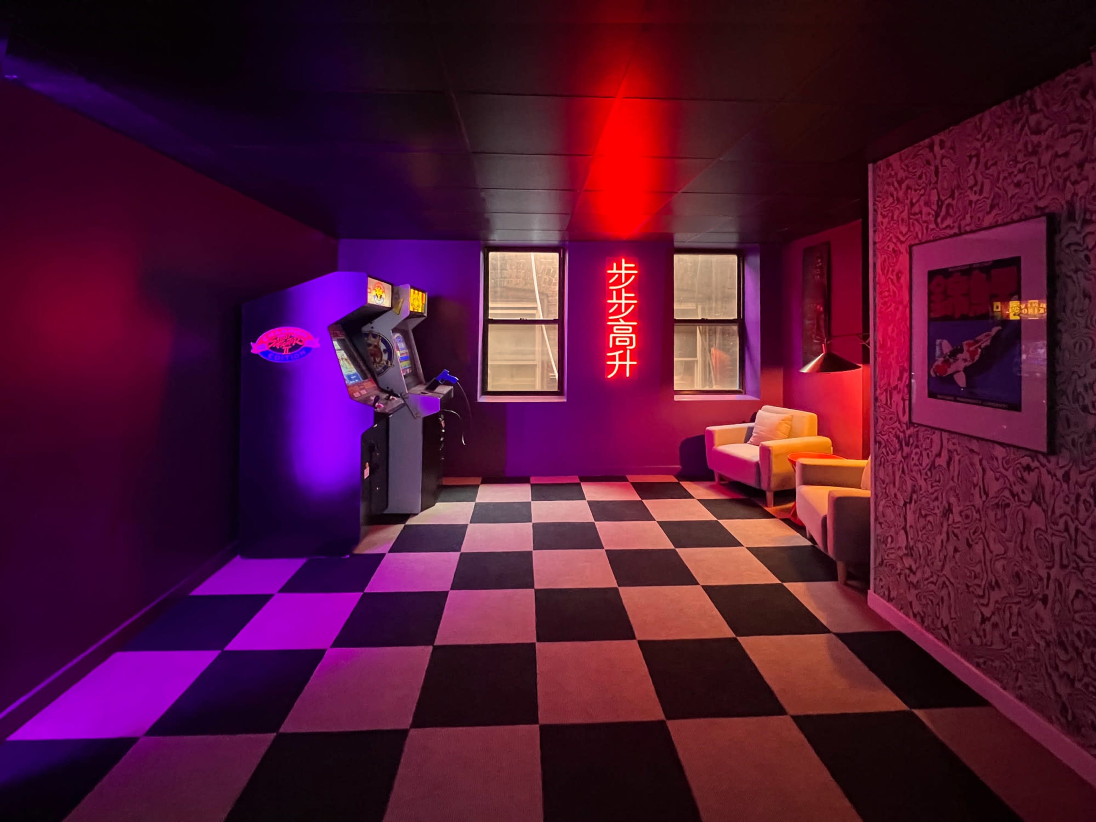 The room features a checkered black and white floor, two windows, an arcade machine in one corner, and a neon sign on the wall.