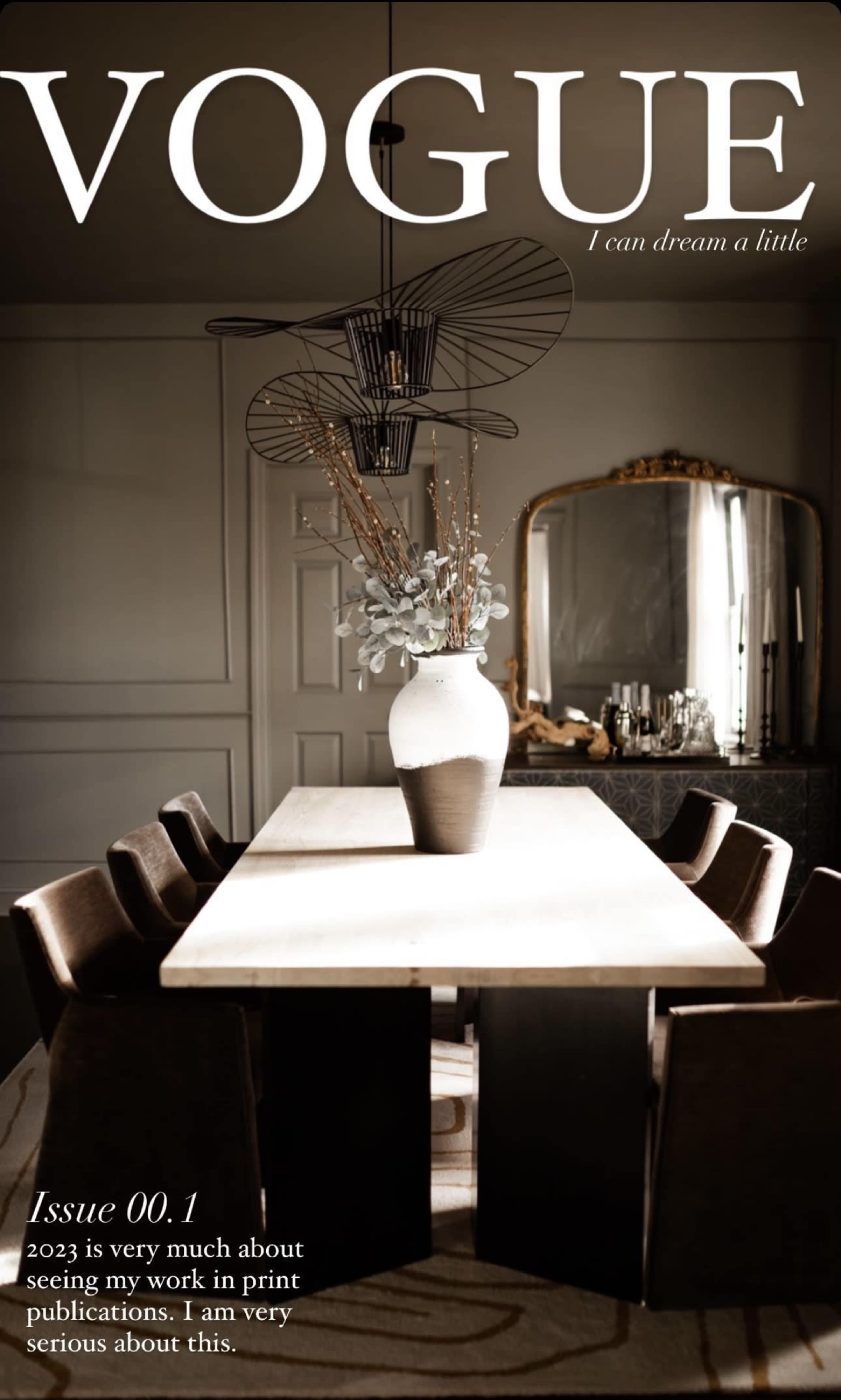 A modern dining room with a long table surrounded by dark wooden chairs, complemented by a large vase of flowers and stylish decor.