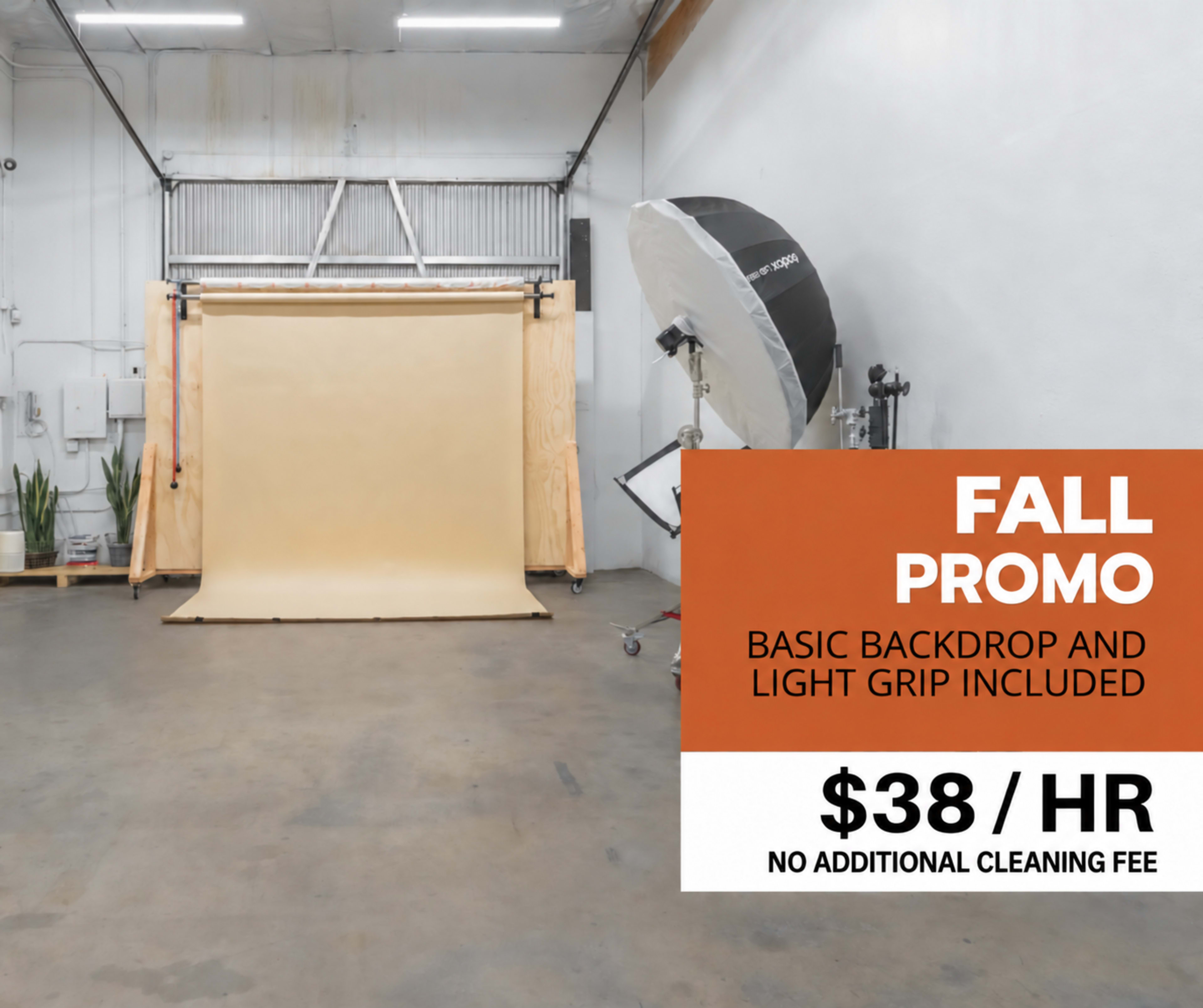 The image shows an empty photography studio featuring a beige backdrop, a large light setup, and promotional text indicating a rate of $38 per hour with a note about no additional cleaning fee.