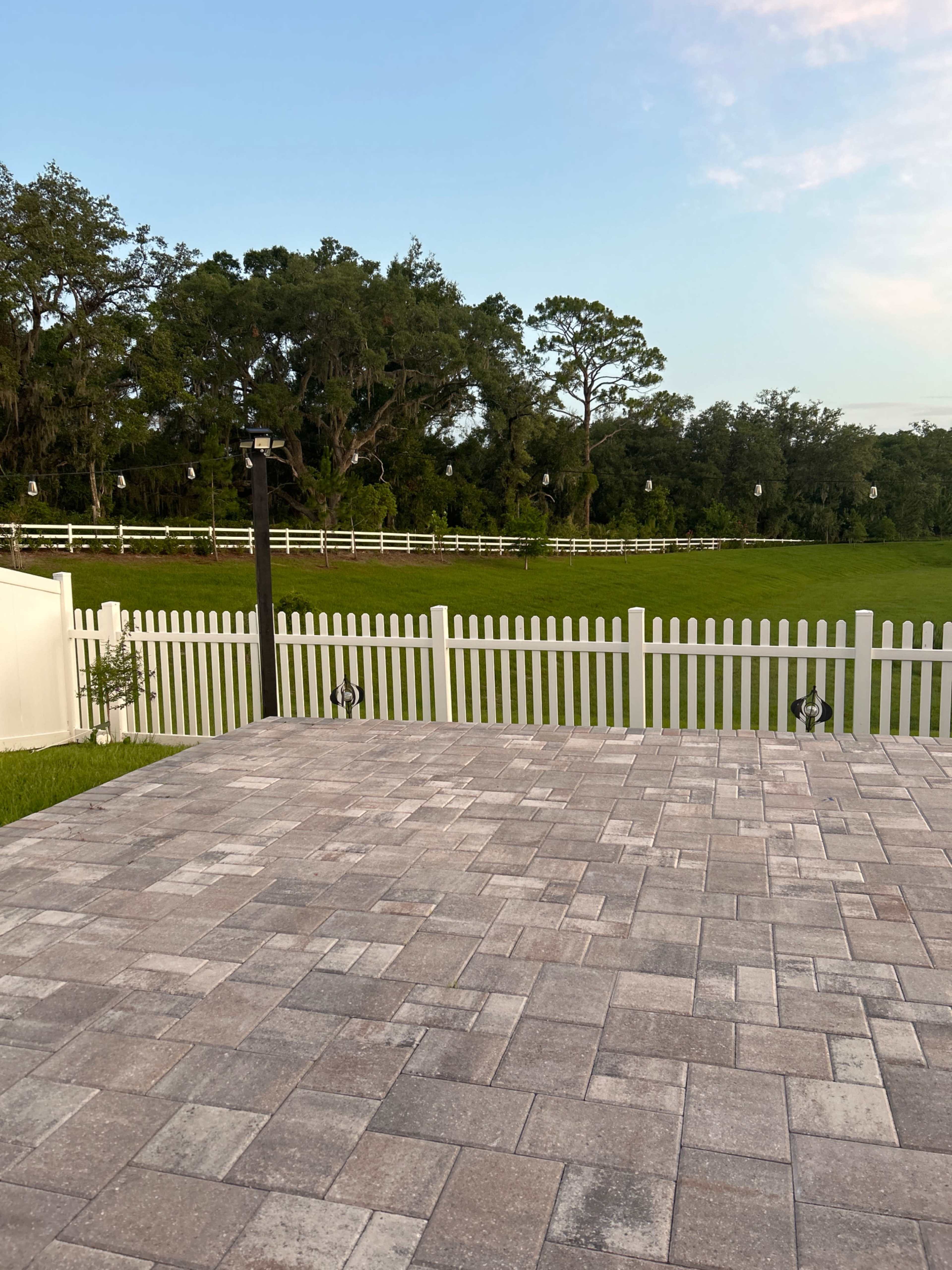 Charming Outdoor Photography Space with Greenery + White Picket Fence Backdrop Image in Leesburg, Okhumpka, FL