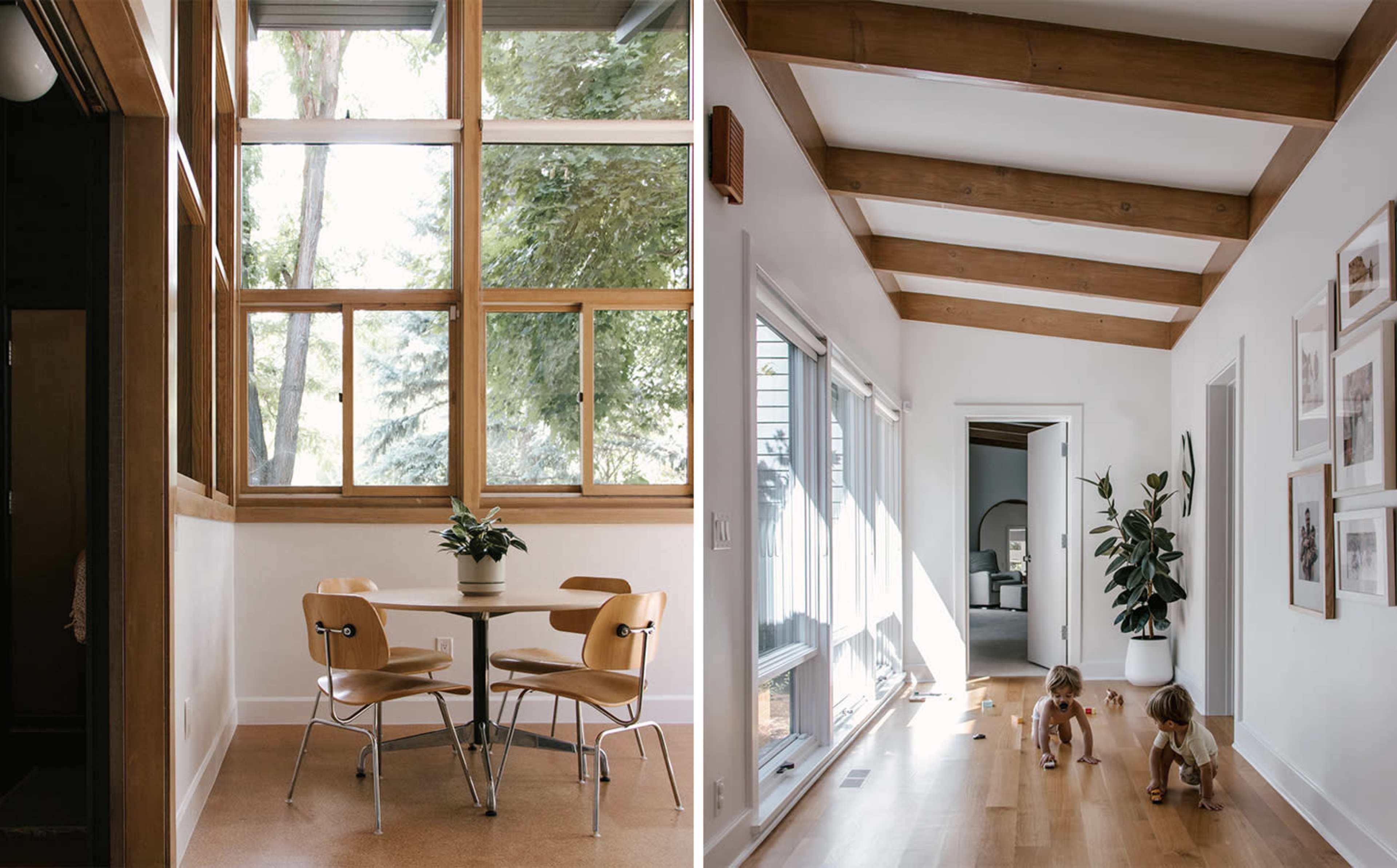 A dining area with a table and chairs next to large windows on the left, and a hallway with wooden beams and children playing on the right.