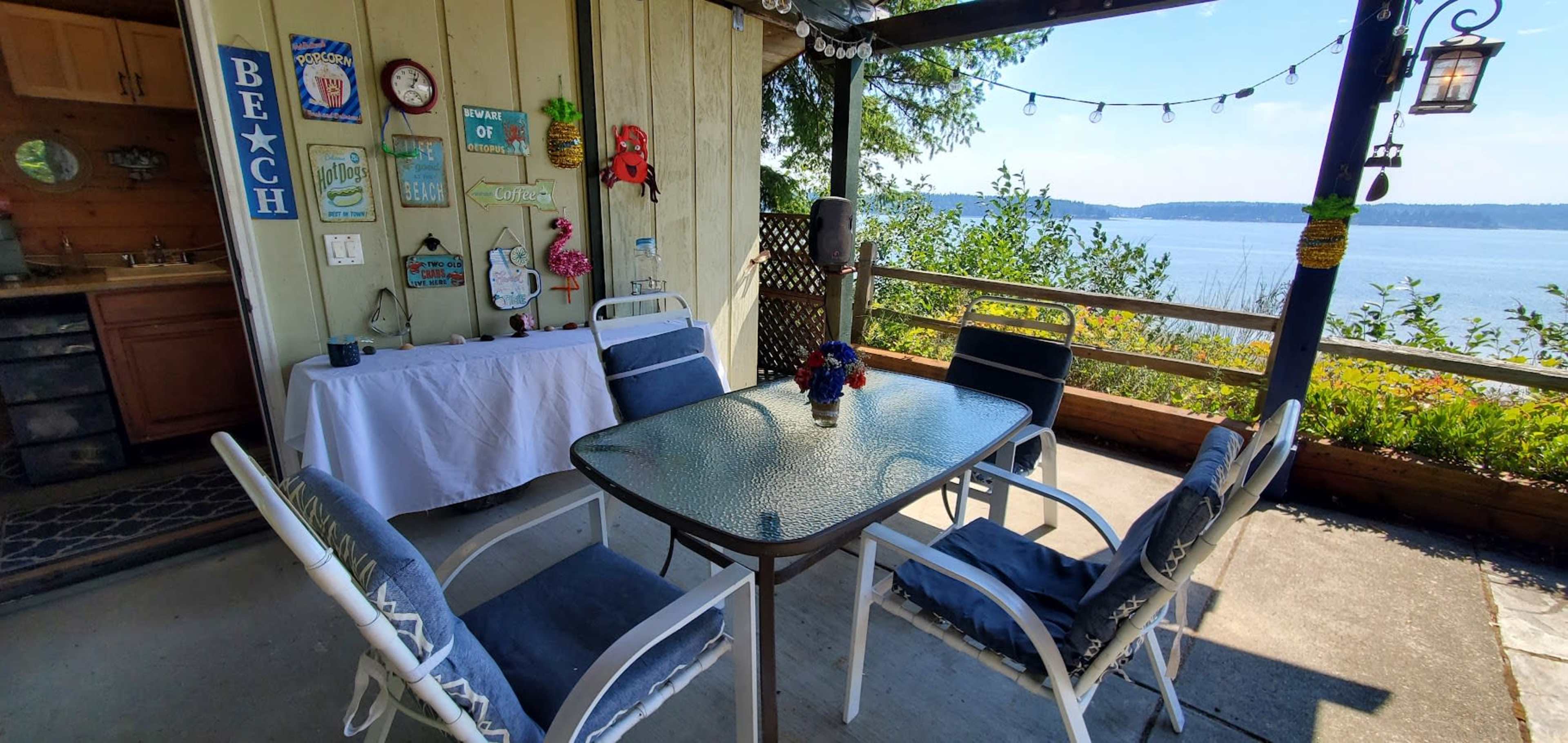 Cute Wide Waterfront Garden Patio Looking Towards Distant Mt. Rainier Image in Wauna, Gig Harbor, WA
