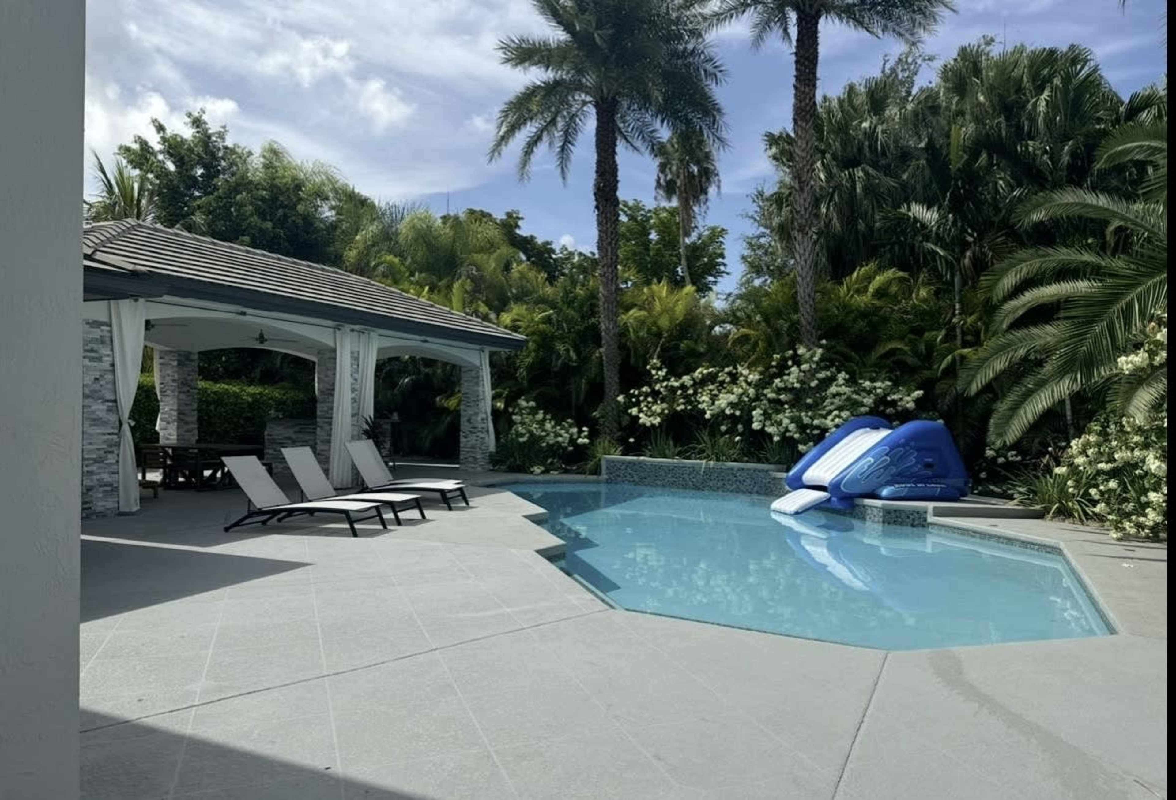 Backyard Oasis with Cabana and Outdoor Kitchen Image in West End, Miami, FL