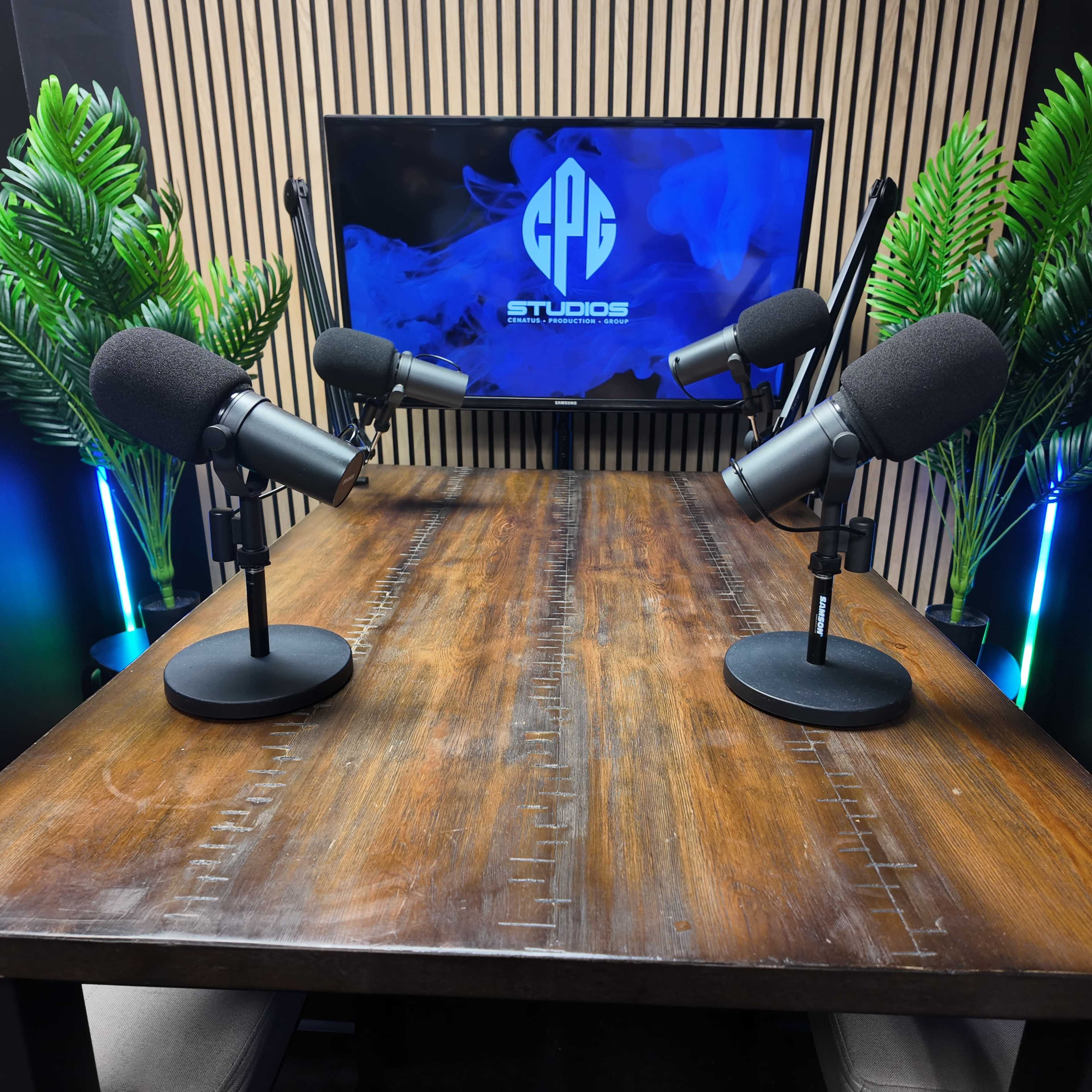 The image shows a podcast recording setup featuring two microphones on a wooden table facing a screen displaying the logo for "CPC Studios."