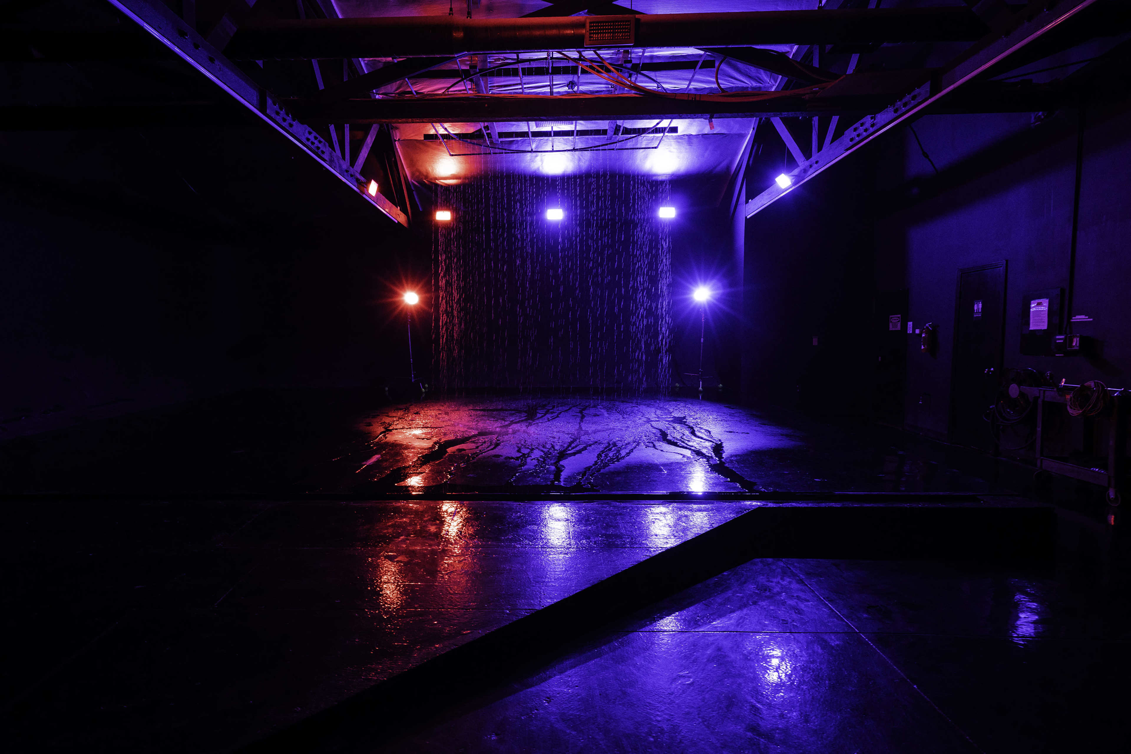 Blackout Car Photo & Video studio with large black cyc wall,  RGB LED Tunnel, rain feature, free parking and roll-up doors - Olympic 2 Image in Boyle Heights, Los Angeles, CA